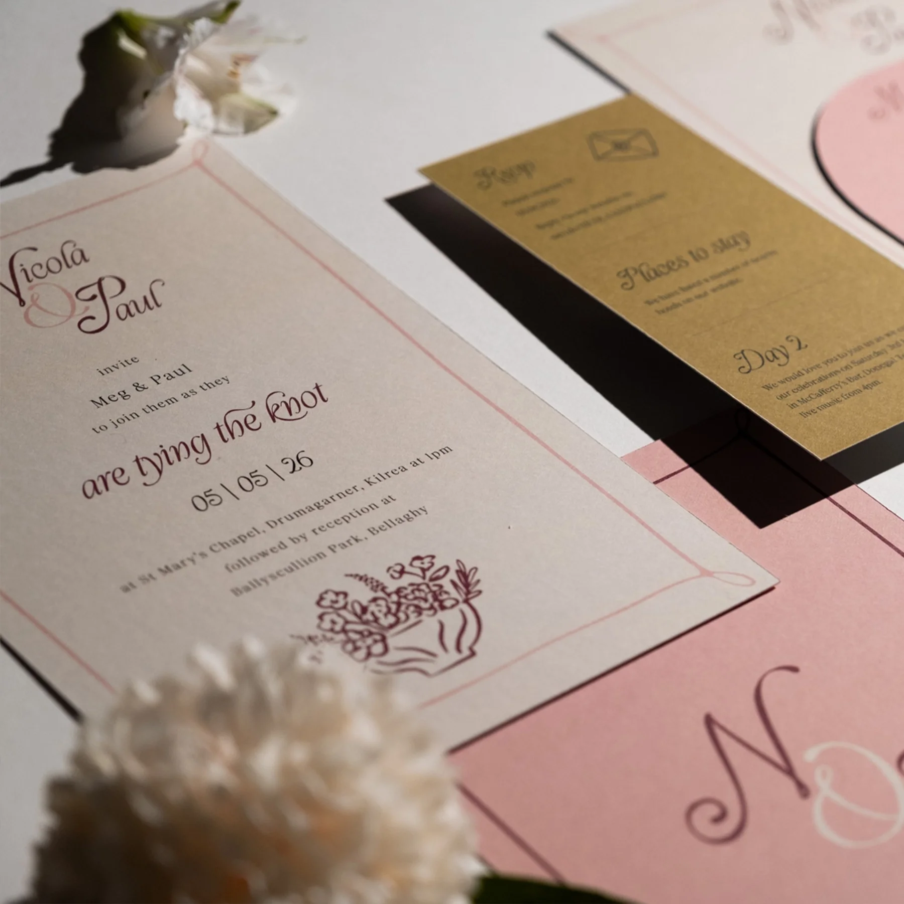 Wedding invitation with floral design, event details, and RSVP information, accompanied by smaller cards with event itinerary and seating plan.