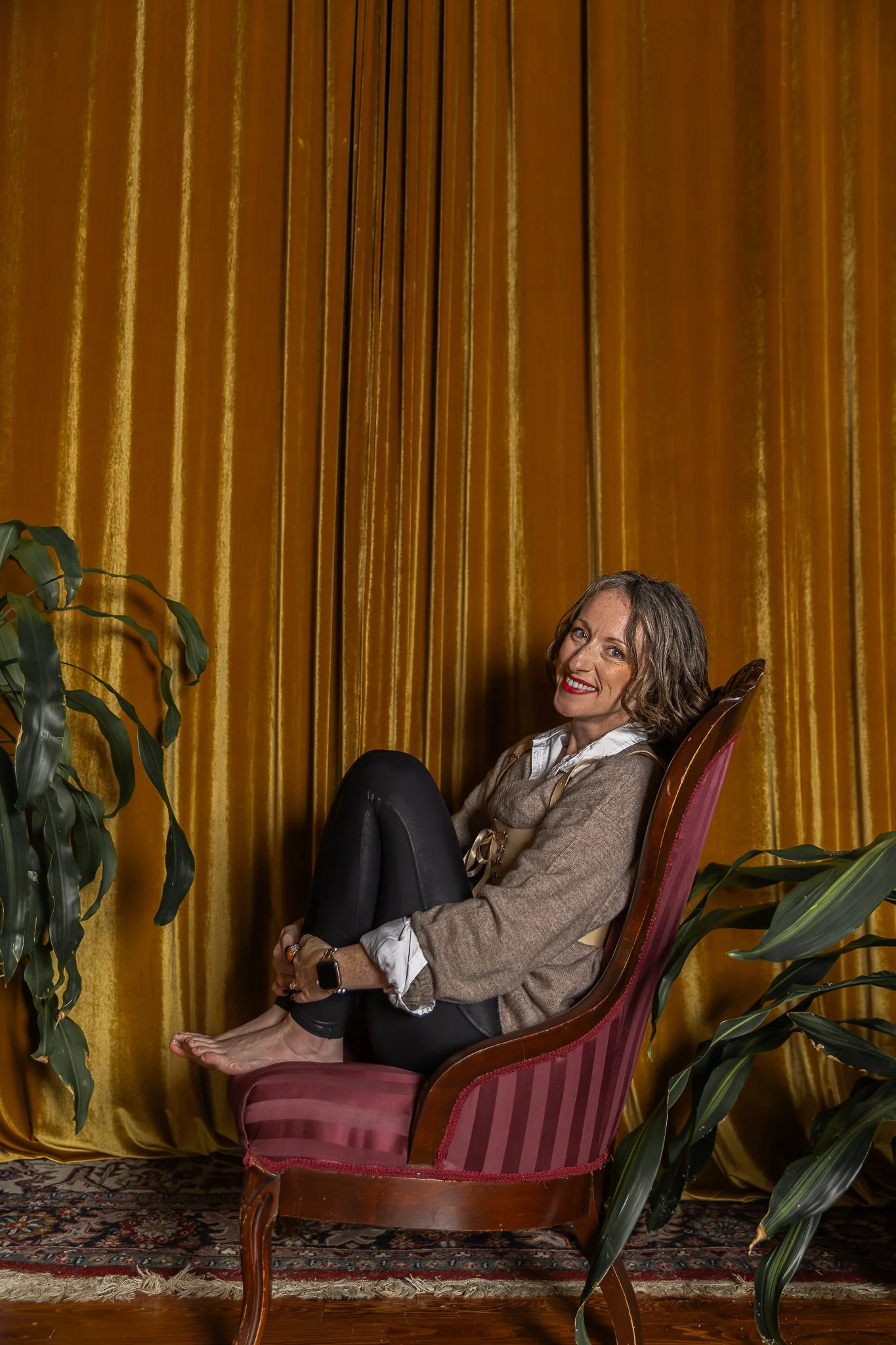 subconscious success strategist bri seeley in front of gold curtain