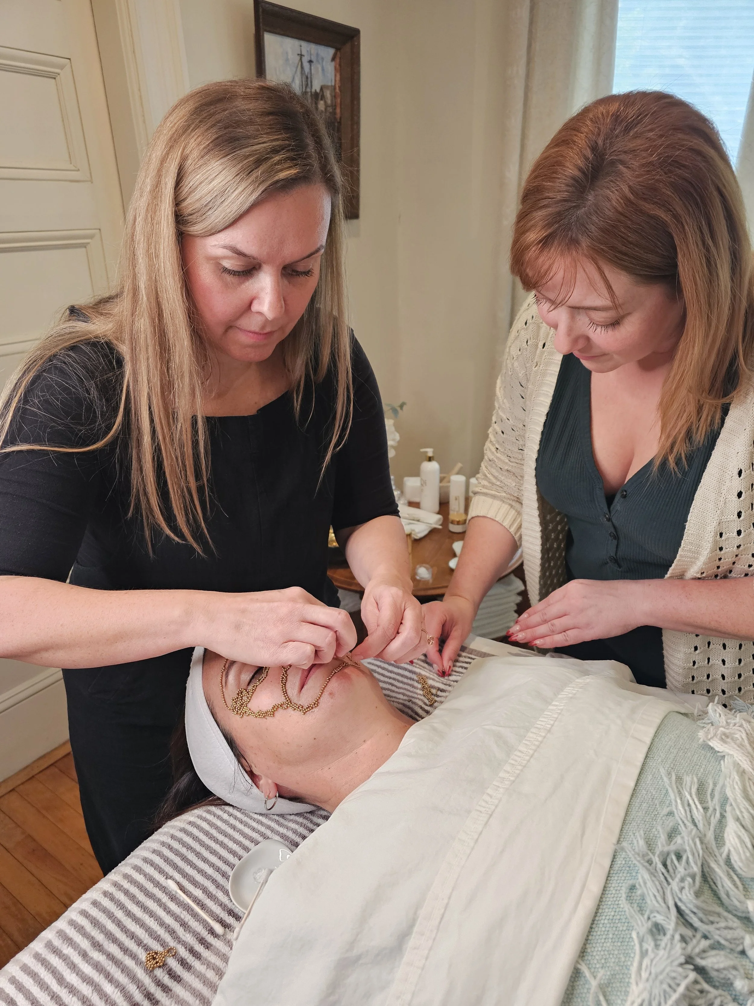 Two Trainees learning Qi beauty with Lisa Dallin