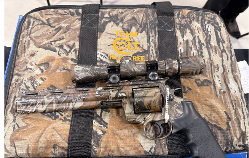 Colt gun with camo finish and camo bag