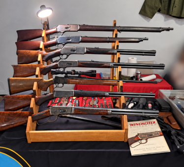 Rifle display with Winchester booklet beside the display