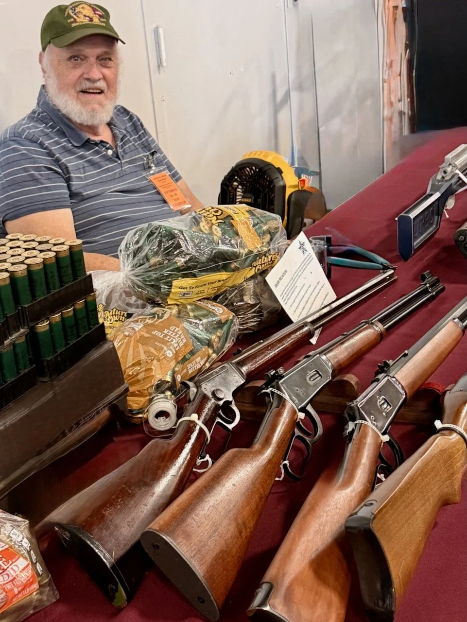 Exhibitor with firearms and ammunition