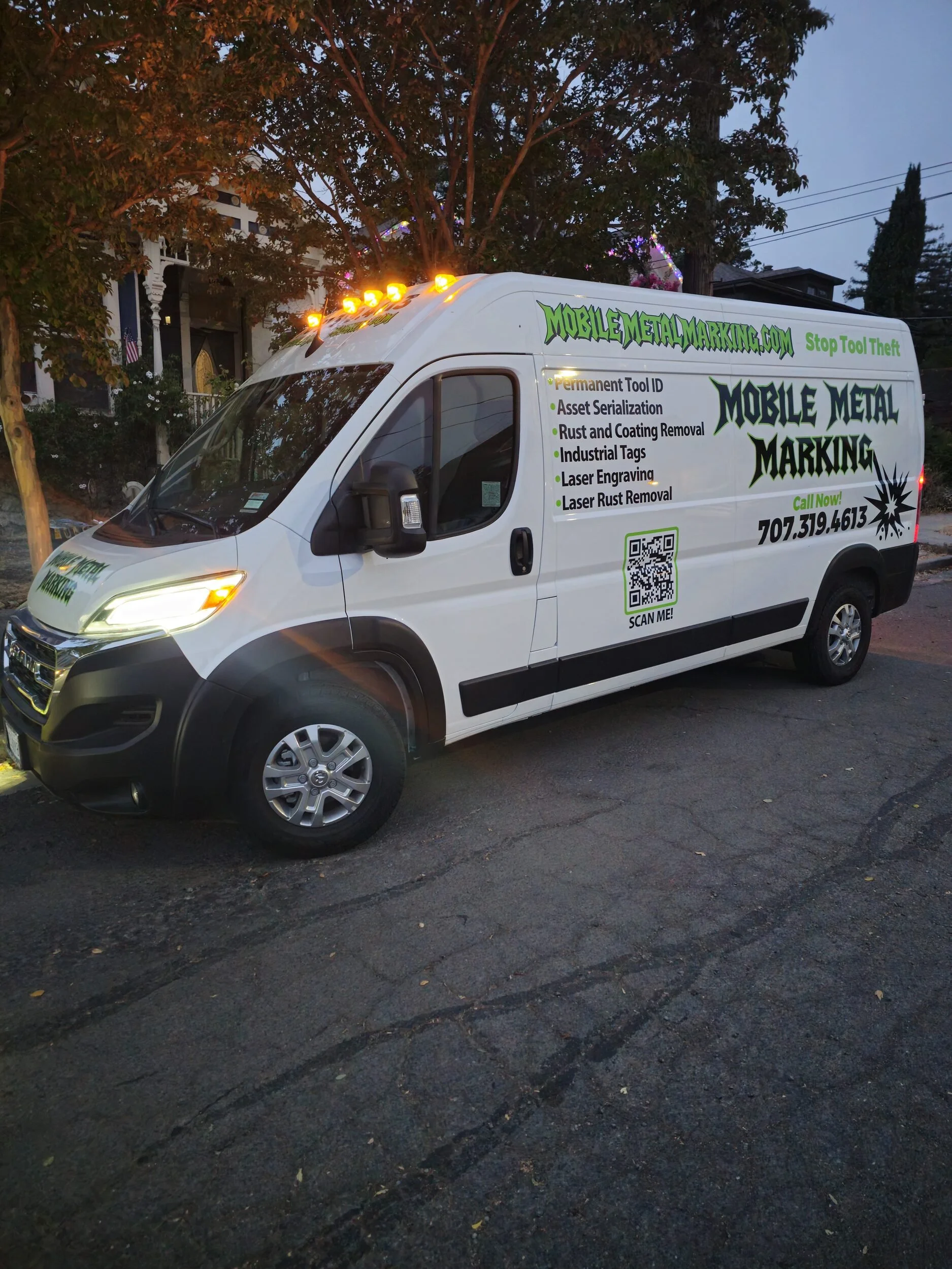 Mobile Metal Marking laser service van at dusk with roof marker lights on