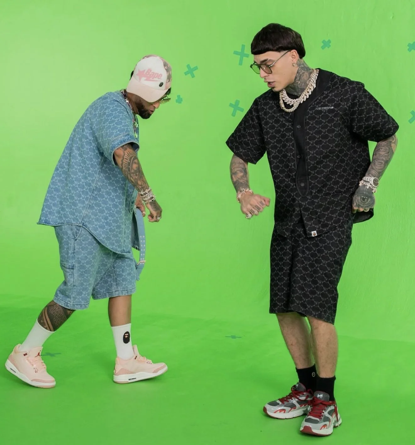 Ovi (Left) in SS25 BAPE Pink STA Trucker Hat, Blue Denim College Monogram Baseball Jersey & Shorts and Ape Head Socks