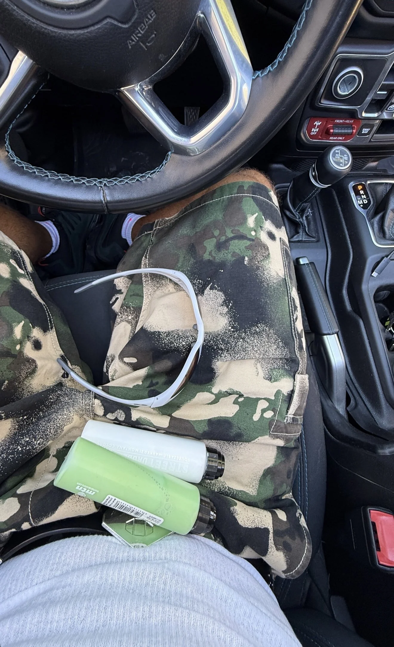 Feid in the SS25 BAPE MAP CAMO GREEN RELAXED FIT CARGO SHORTS