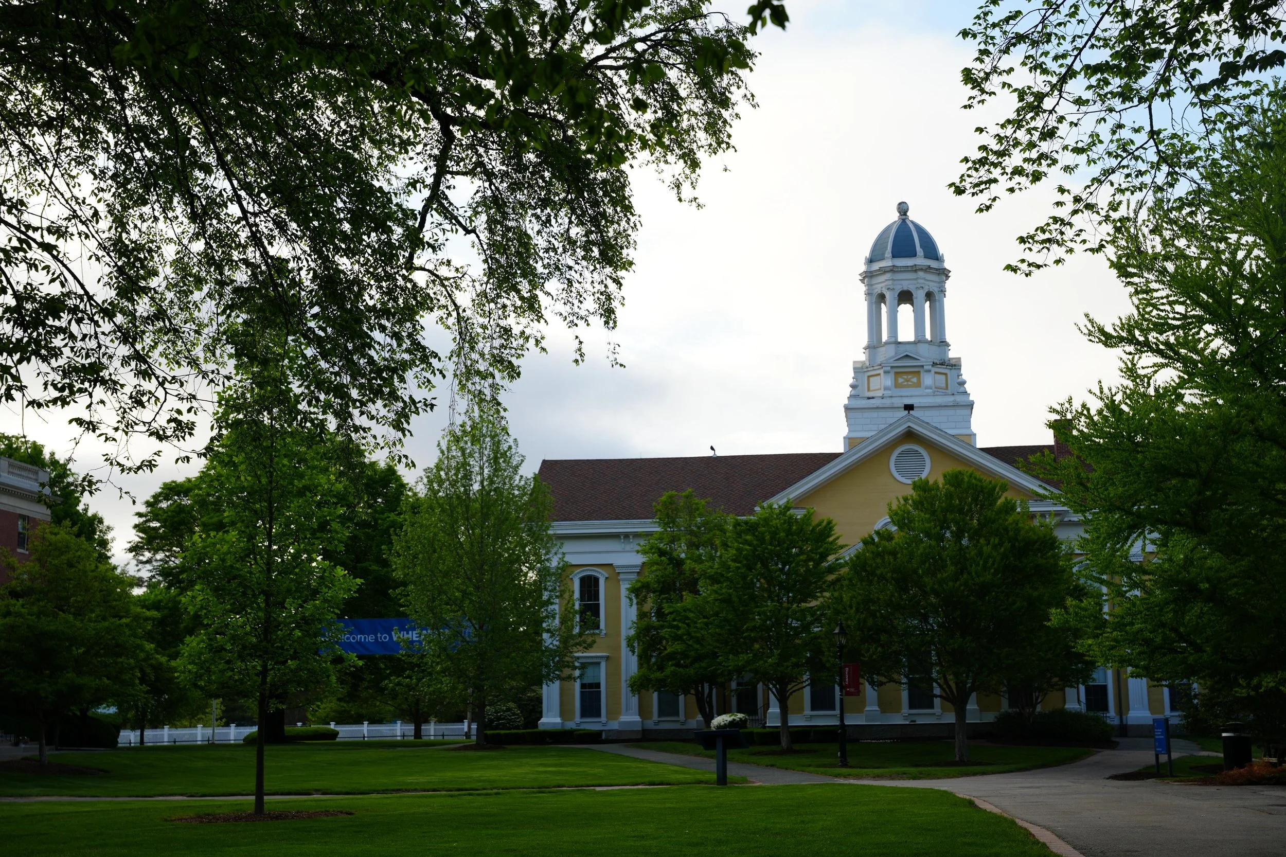 Photograph of Wheaton College's yellow Mary Lyon Hall building