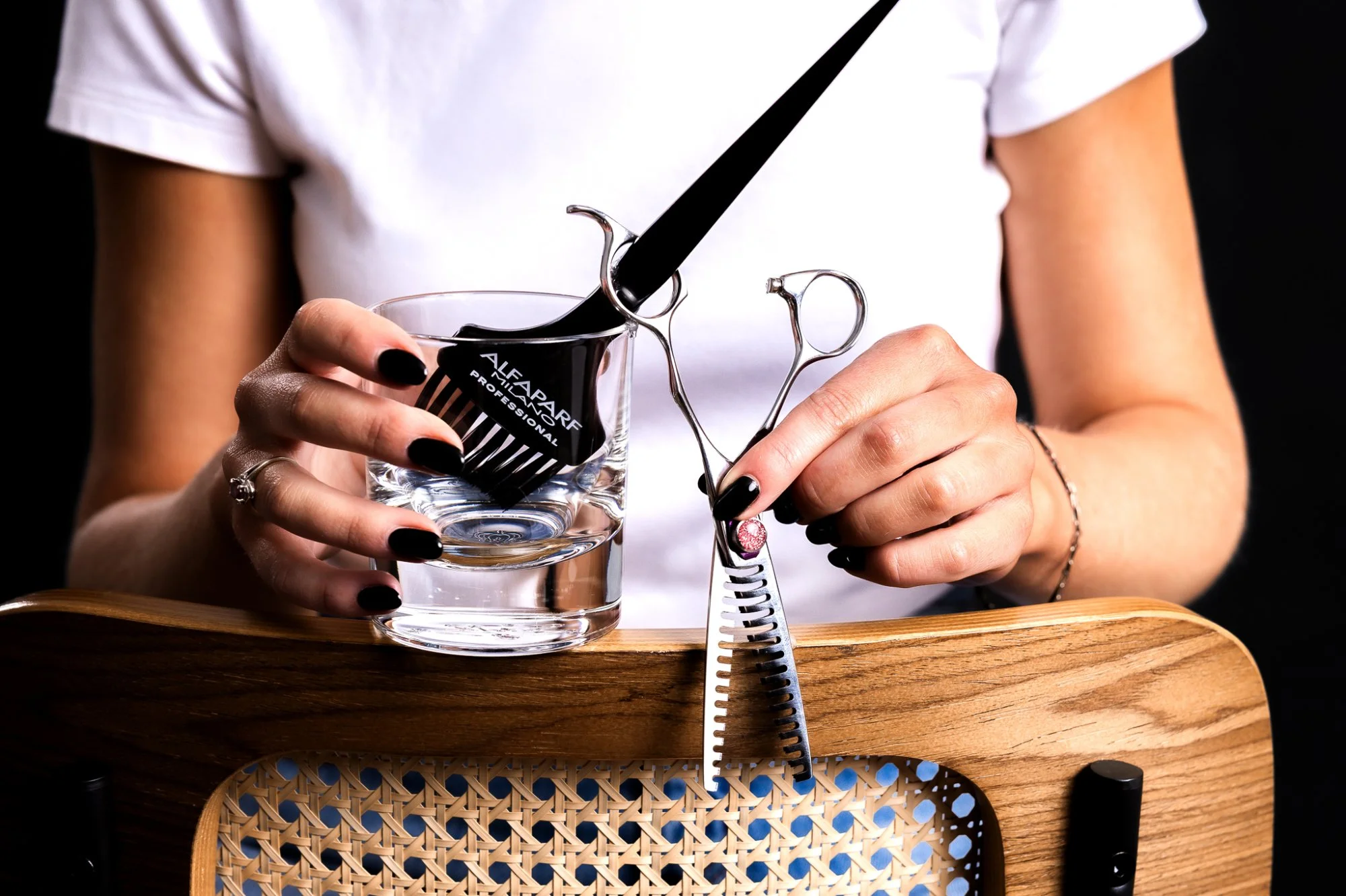 Stylist cutting hair with scissors and comb at Soar & Strand, creating natural movement and effortless confidence