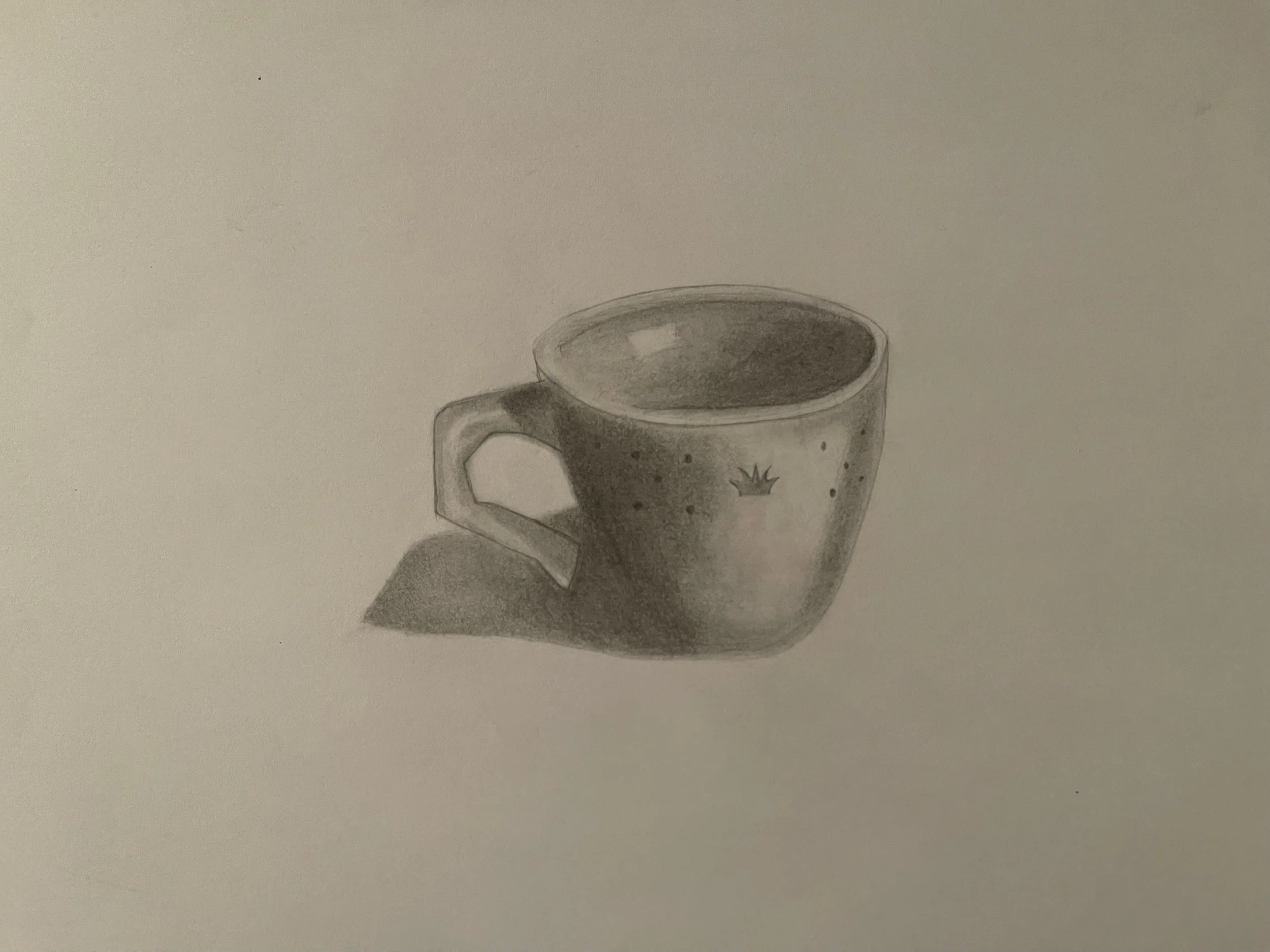 Graphite drawing of a mug with soft shading, showing areas for improved contrast and smoother handle lines.