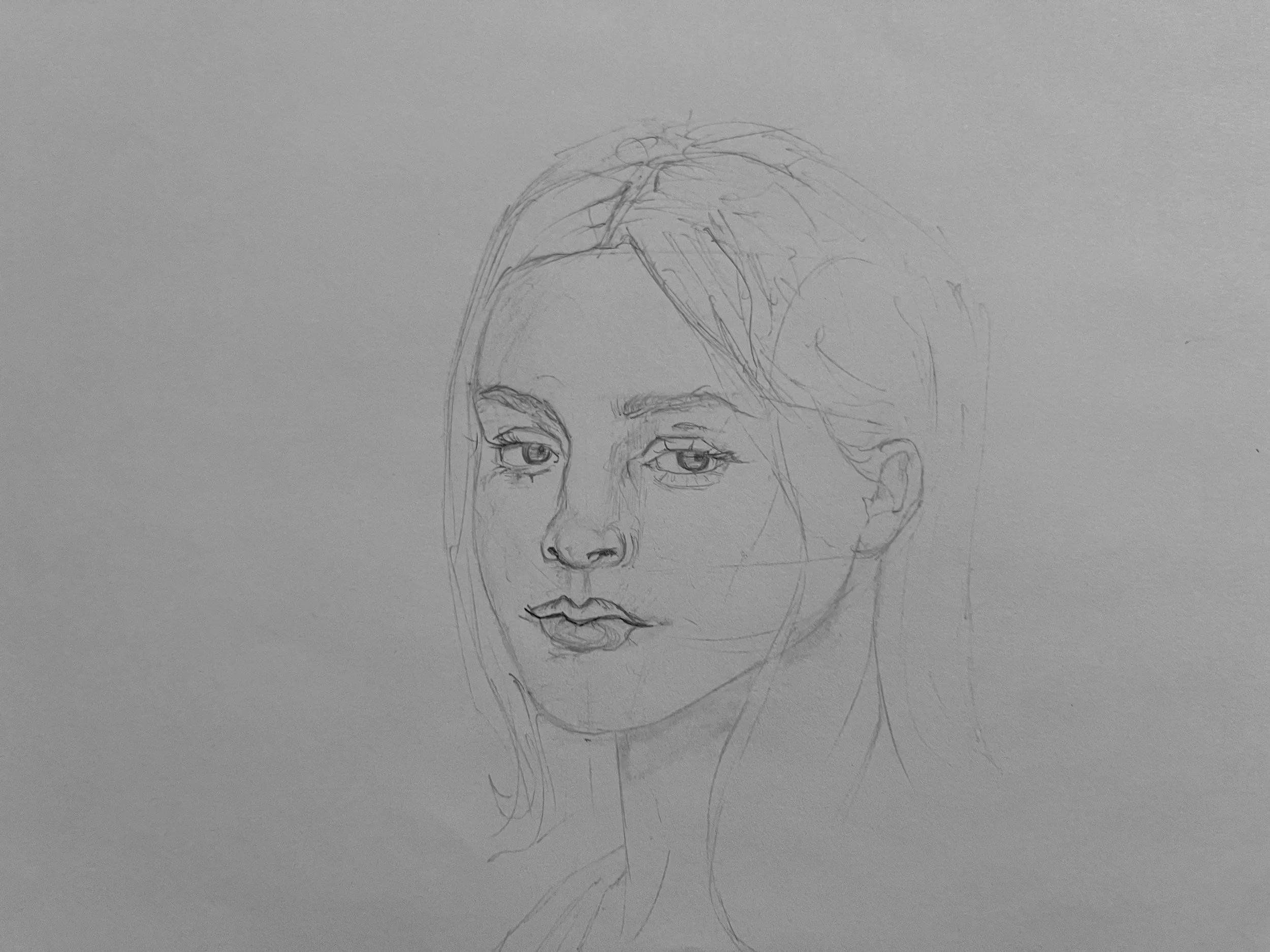 A pencil drawing of a woman's face on a gray background, showing her eyes, nose, lips, and hair.