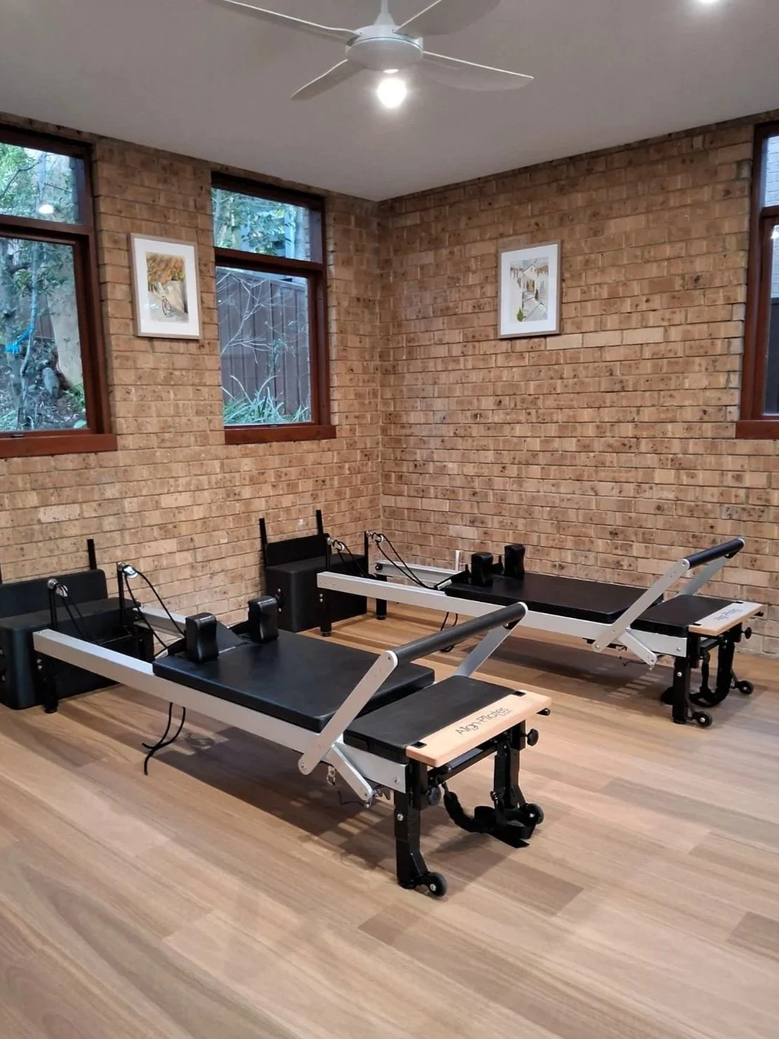 Pilates reformer machines in modern boutique studio