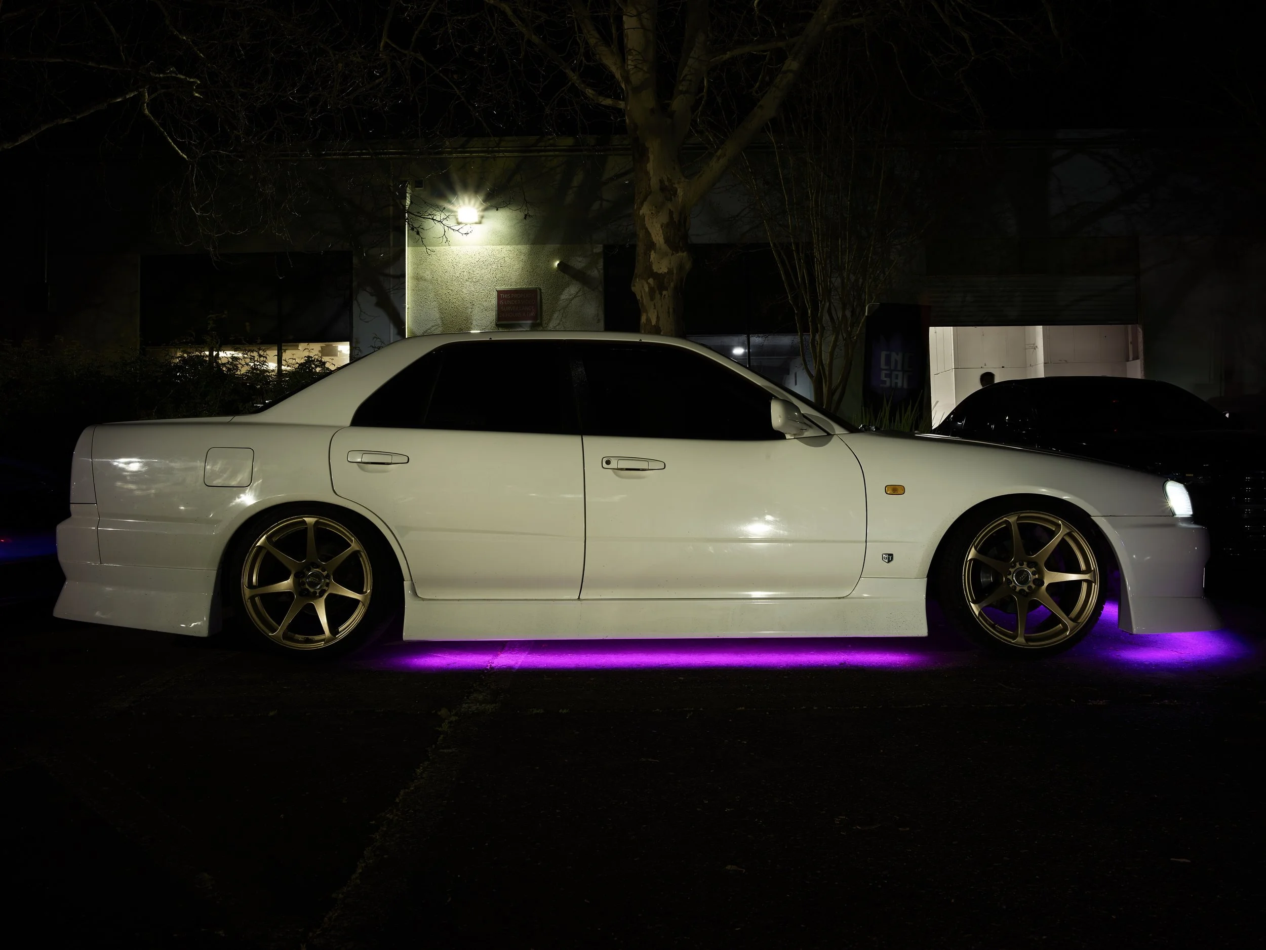 white four door nissan skyline