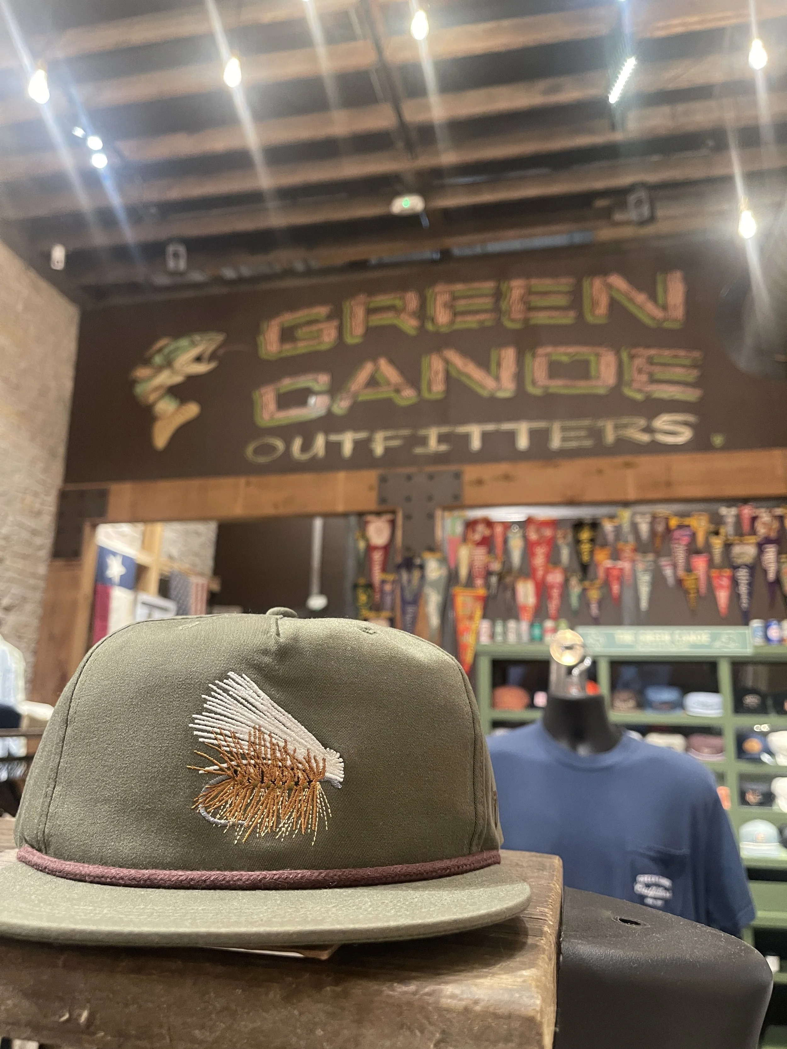 hat on a shelf at green canoe in hico