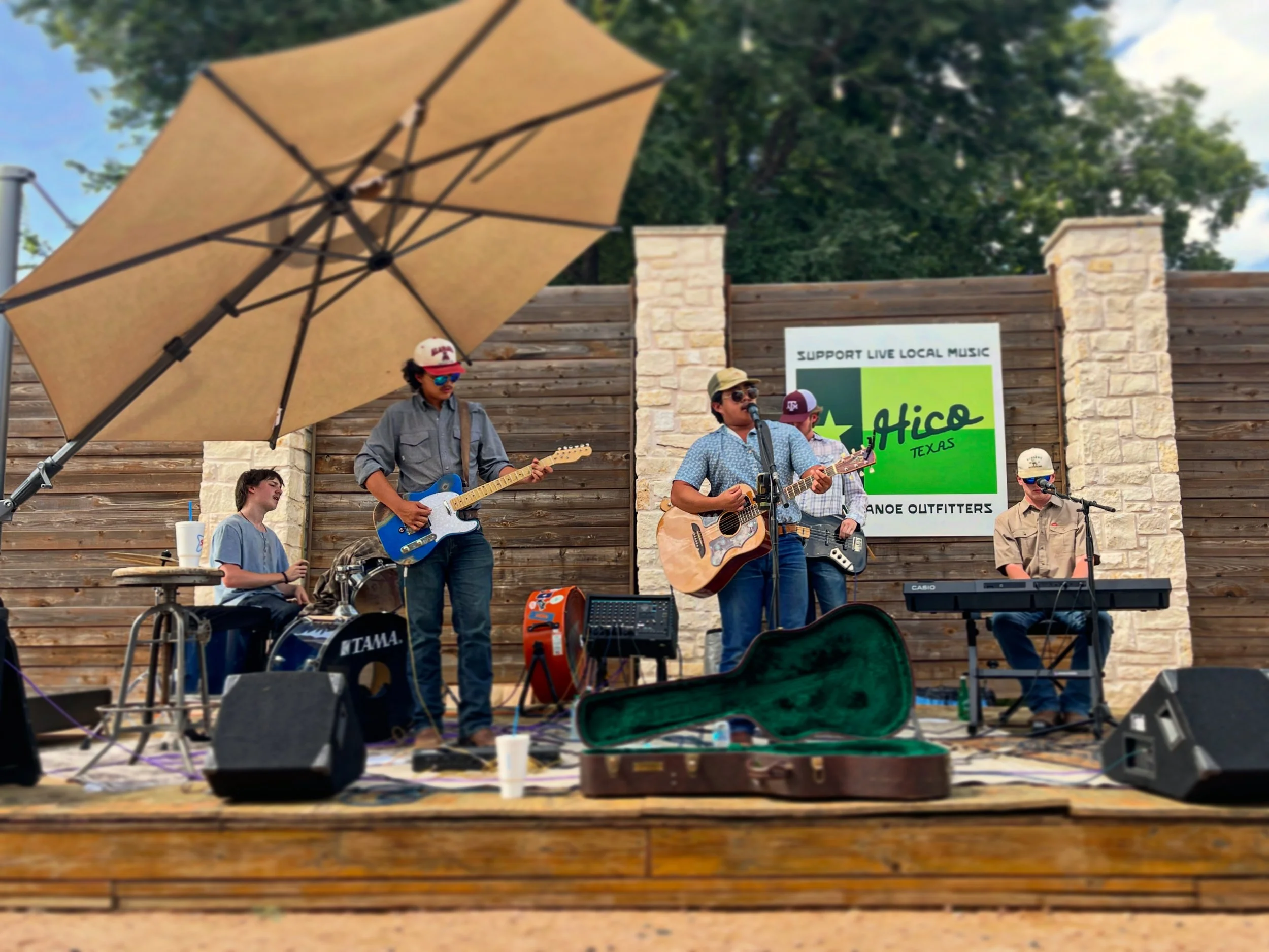 band on stage at green canoe hico