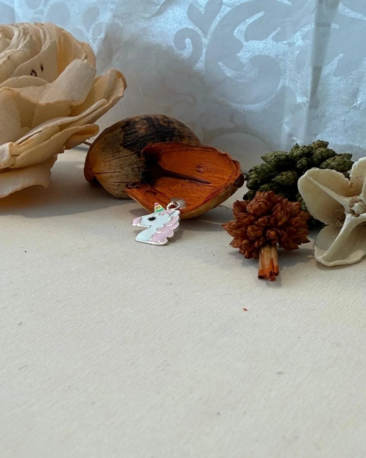 Silver unicorn pendant with enamel