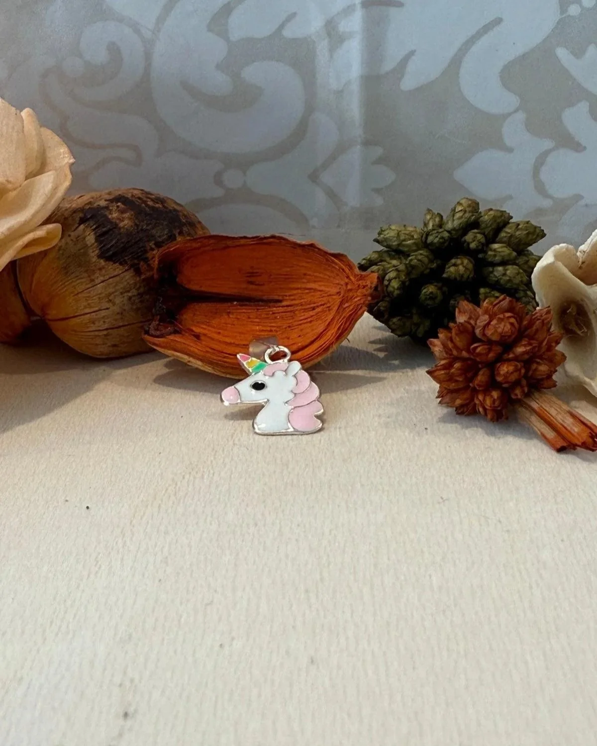 Silver unicorn pendant with enamel