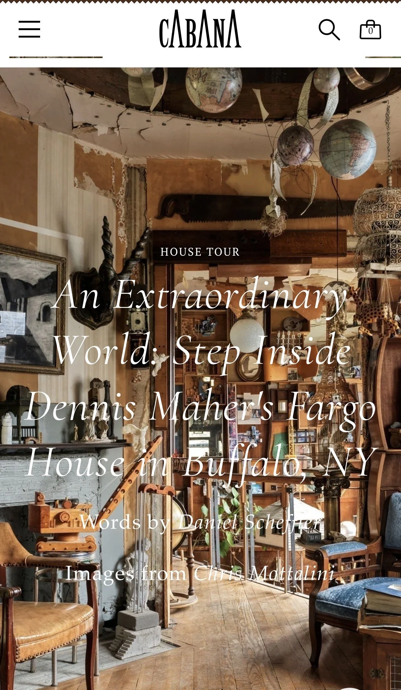 Interior of a vintage thrift store or antique shop filled with various furniture, decorations, and art pieces, including globes and a twisted sculpture hanging from the ceiling.