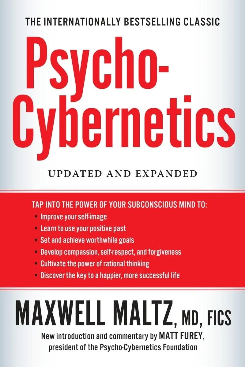 Cover of the book titled "Psycho-Cybernetics" by Maxwell Maltz, MD, FICS, with a red and white color scheme and text highlighting its updated and expanded content.