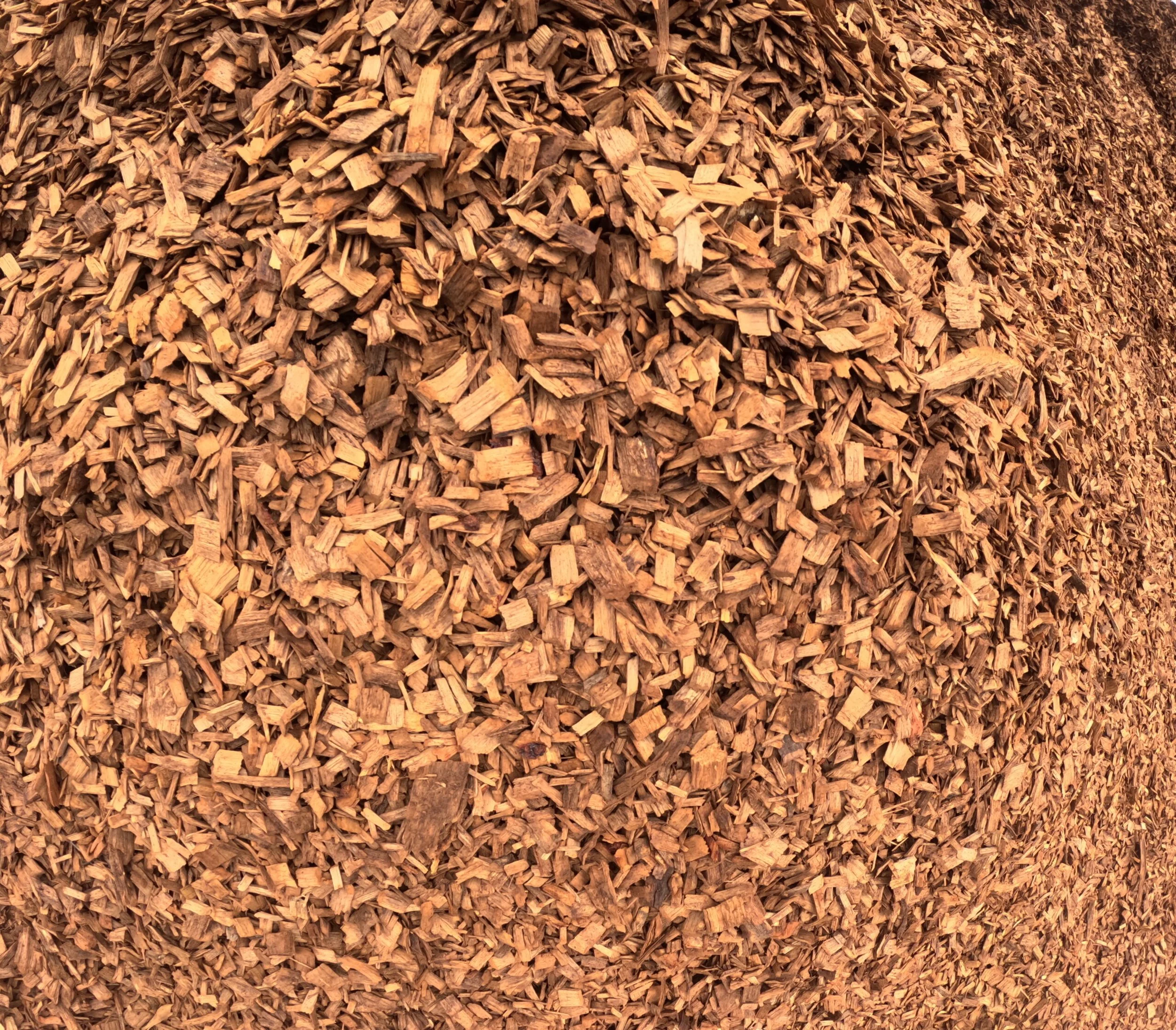 Close-up of a large pile of chopped firewood.