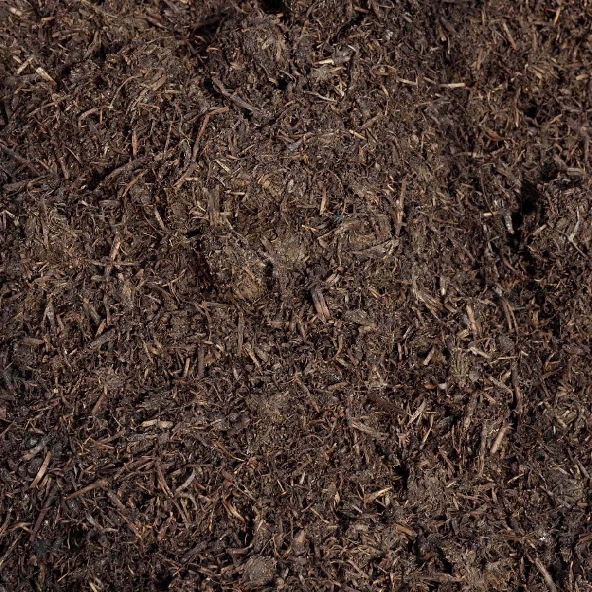 Close-up of dark, moist, shredded organic compost.