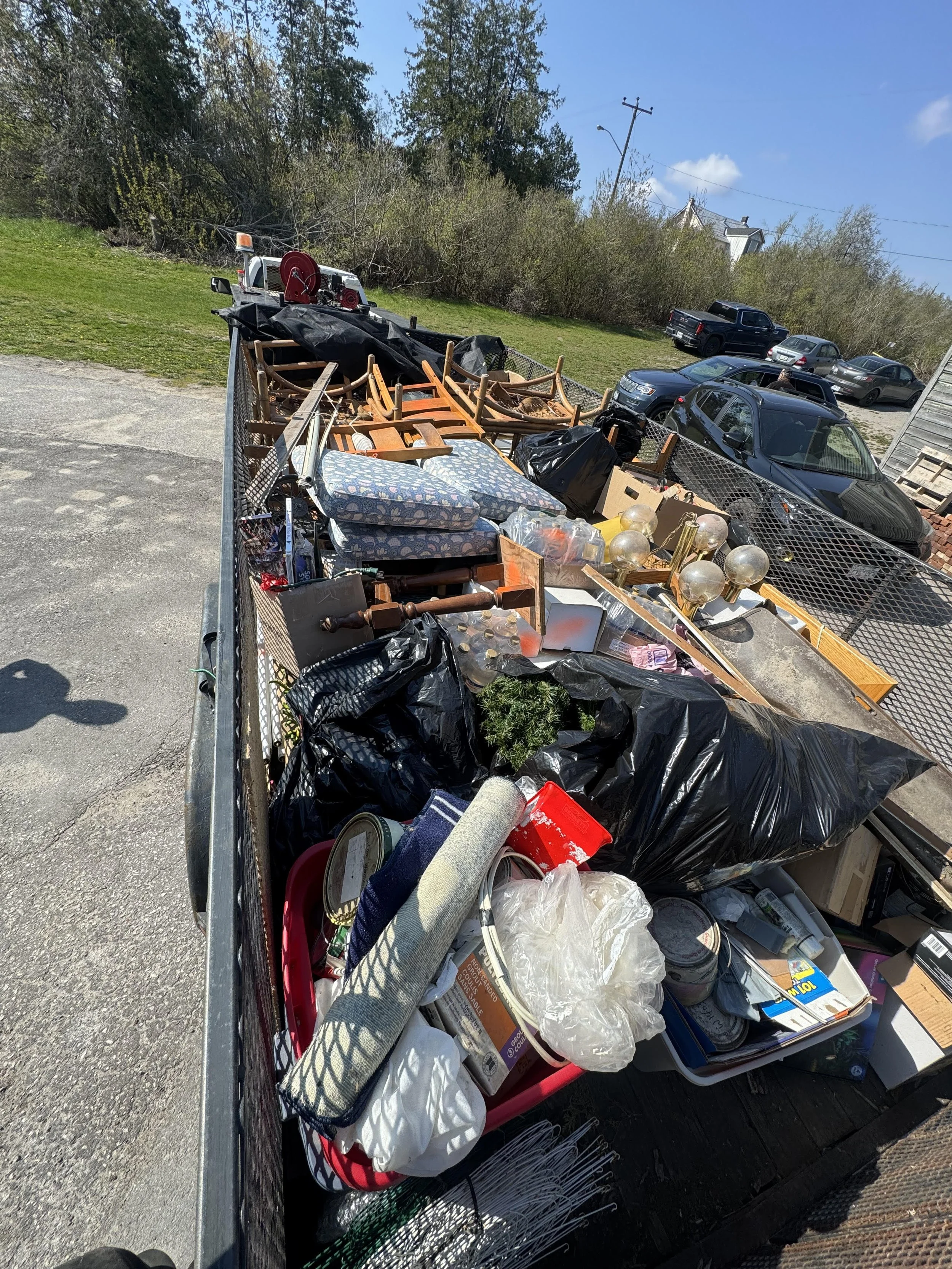 Household and Commercial junk removal service with loaded trailer in Orillia, Ontario