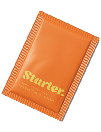 Orange packet labeled 'Starter' containing yogurt starter with Lactobacillus acidophilus.