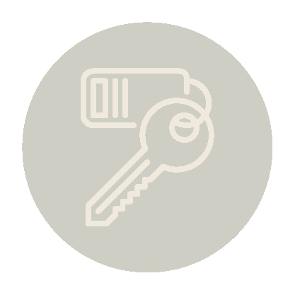 Icon of a key with a keychain on a circular background