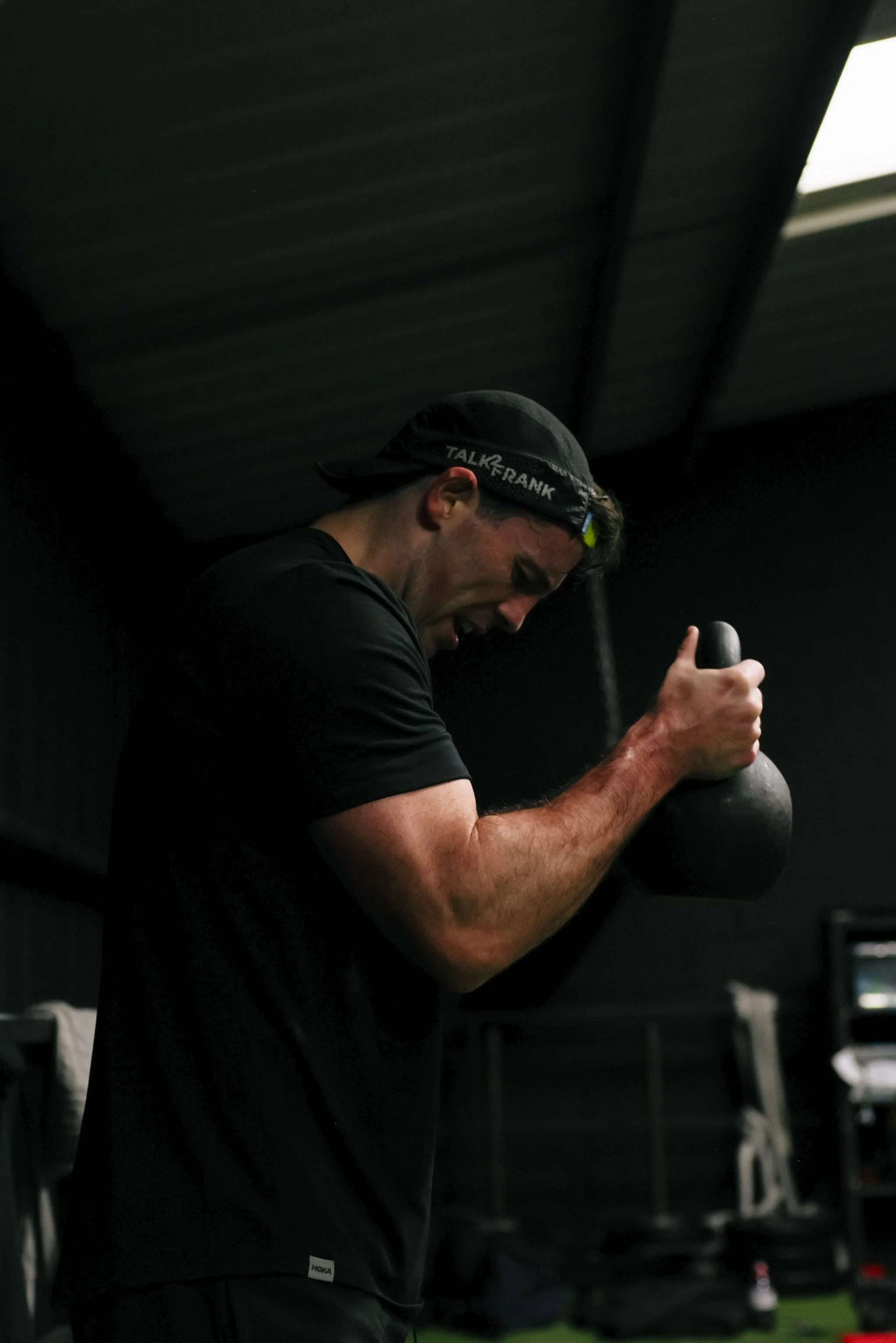 Personal trainer in Liverpool performing kettlebell core strength exercise inside a gym