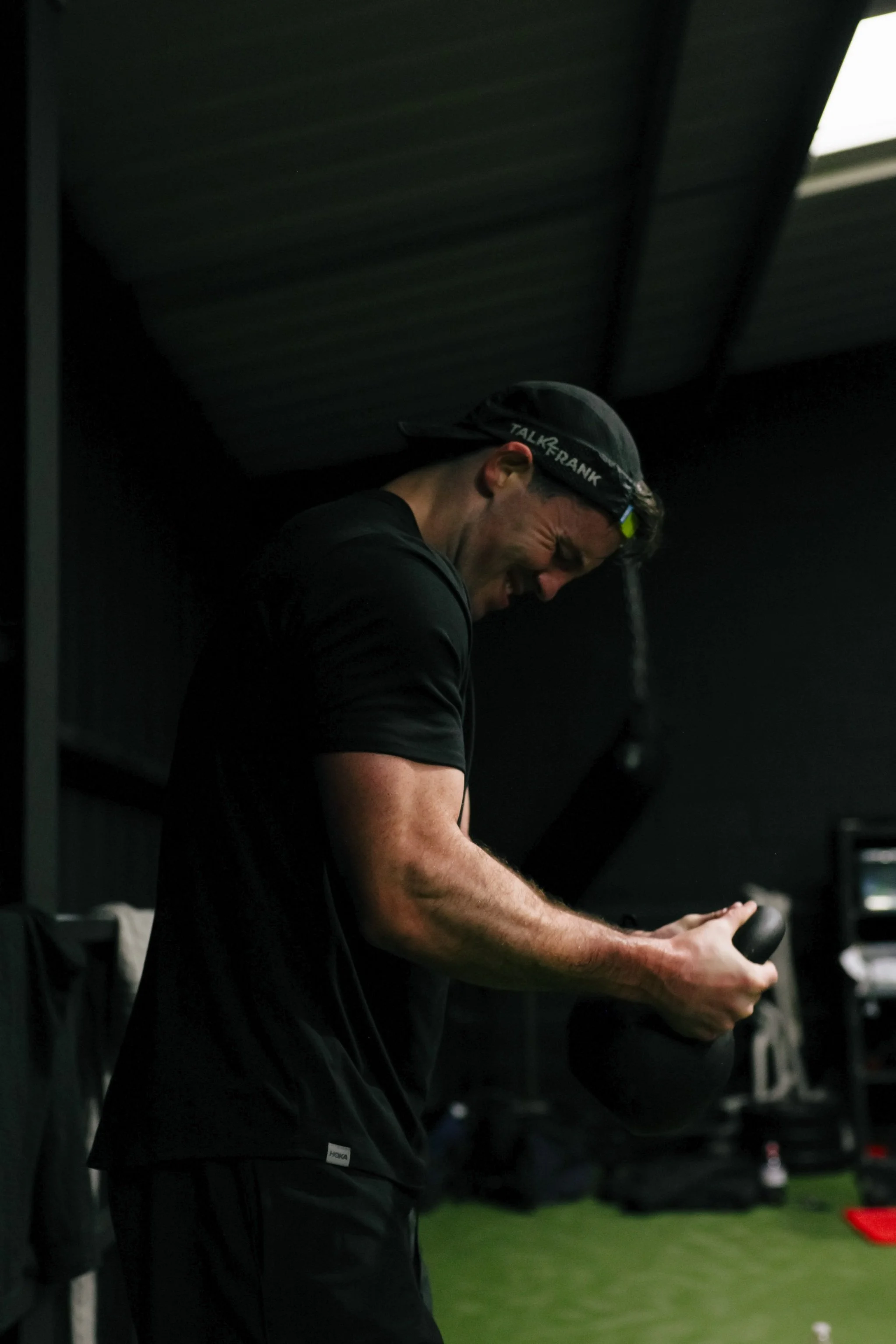 Personal trainer in Liverpool performing kettlebell strength training exercise in a private gym