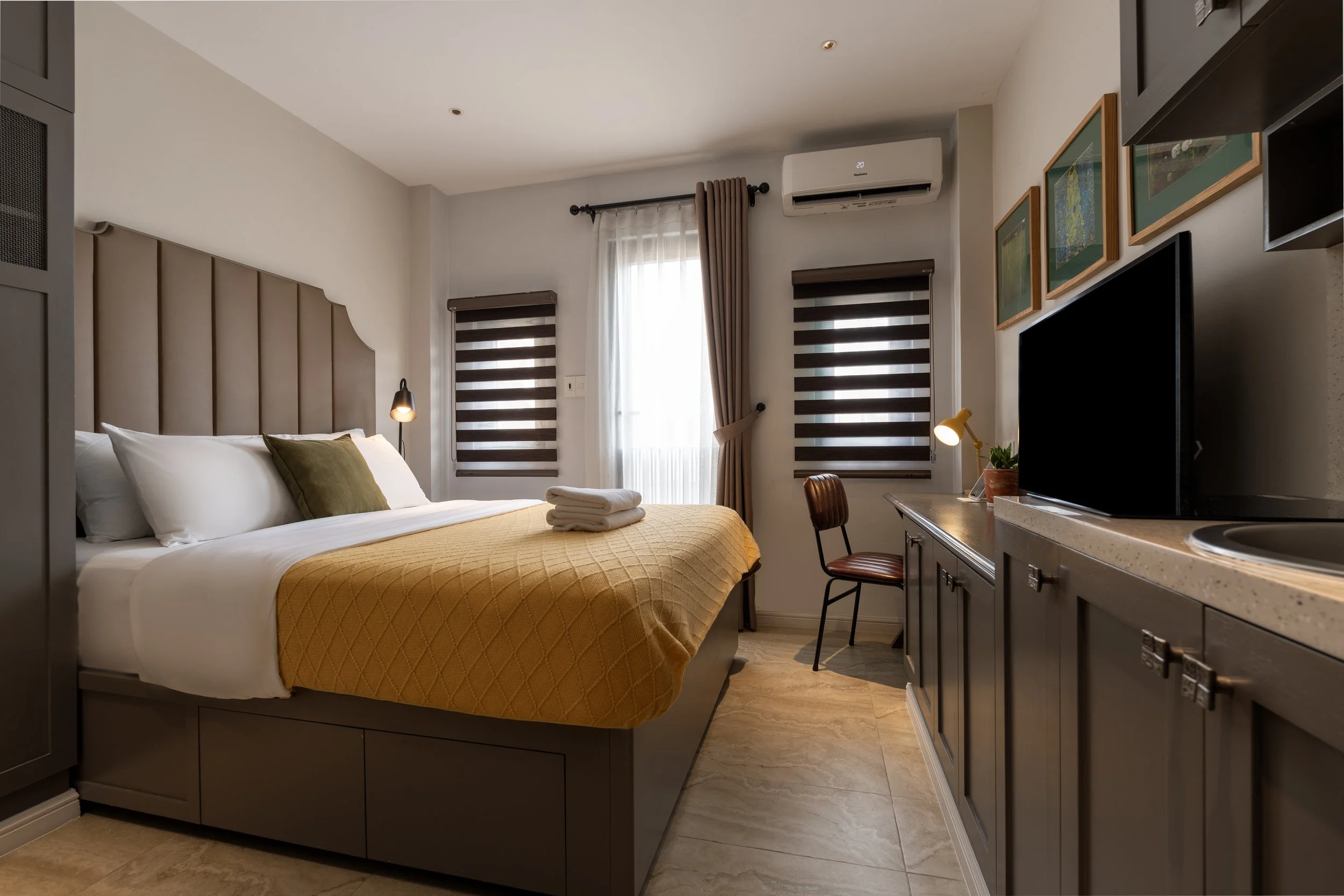 Private furnished studio with kitchenette and workspace at Kolab Living in Da Kao, District 1.