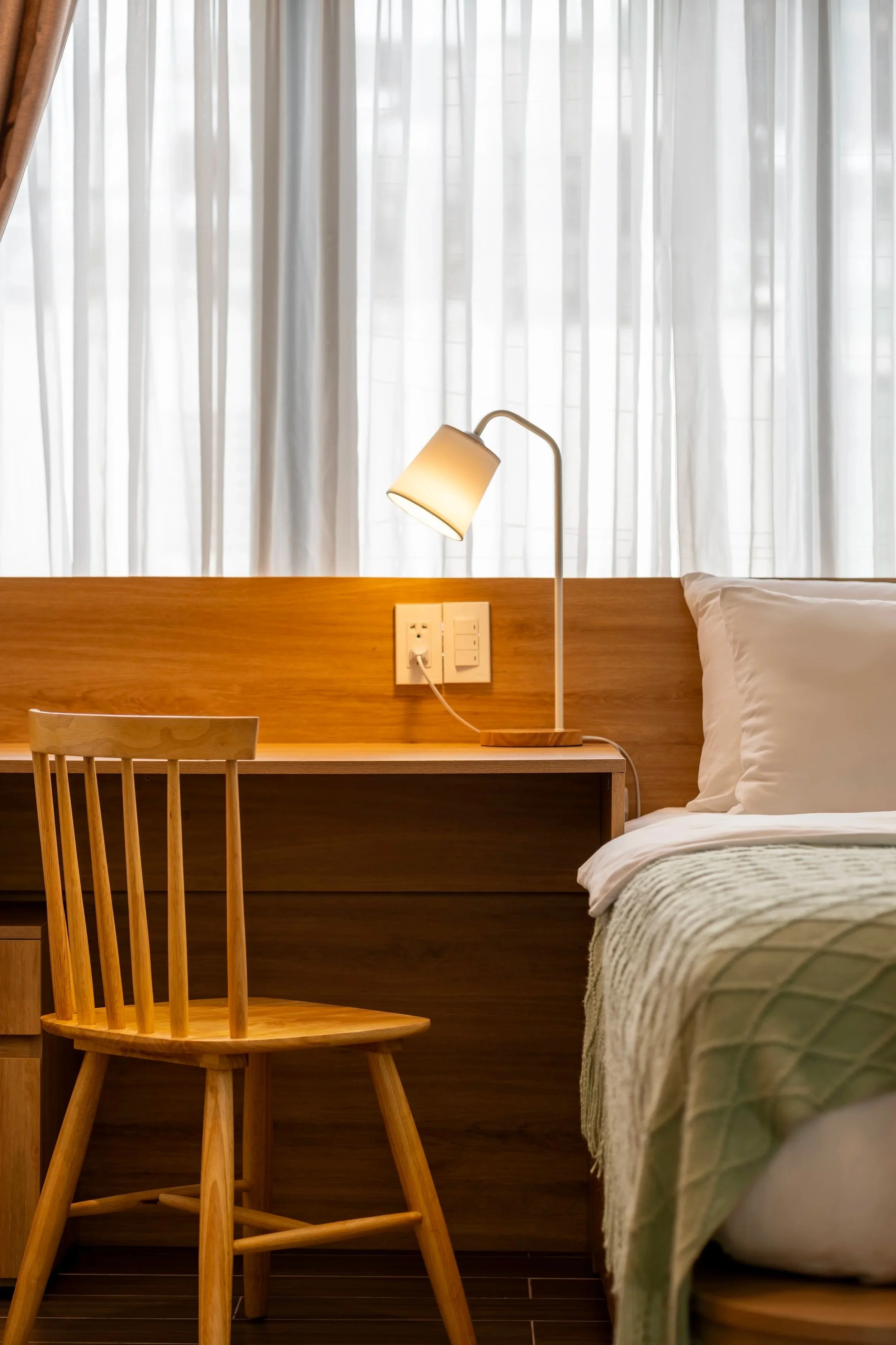 Fully furnished studio at Kolab Neighbours featuring a workspace and natural light.