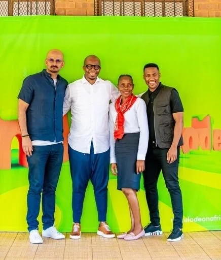 Monde Twala and Dillon Khan at Morakoma Primary school where Nickelodeon and Bath Shoes donated shoes to 250 children to enable them to walk their journey with dignity