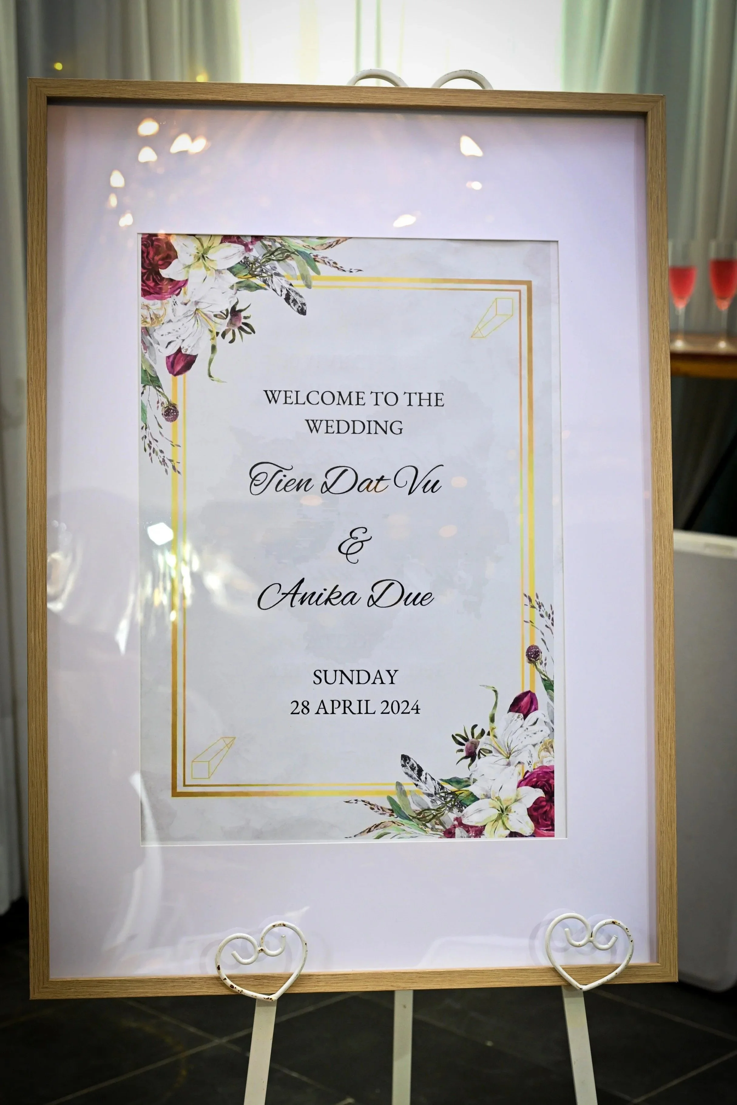 Wedding welcome sign with floral decorations, displaying text for wedding of Tien Dat Vu and Anika Due on Sunday, April 28, 2024.