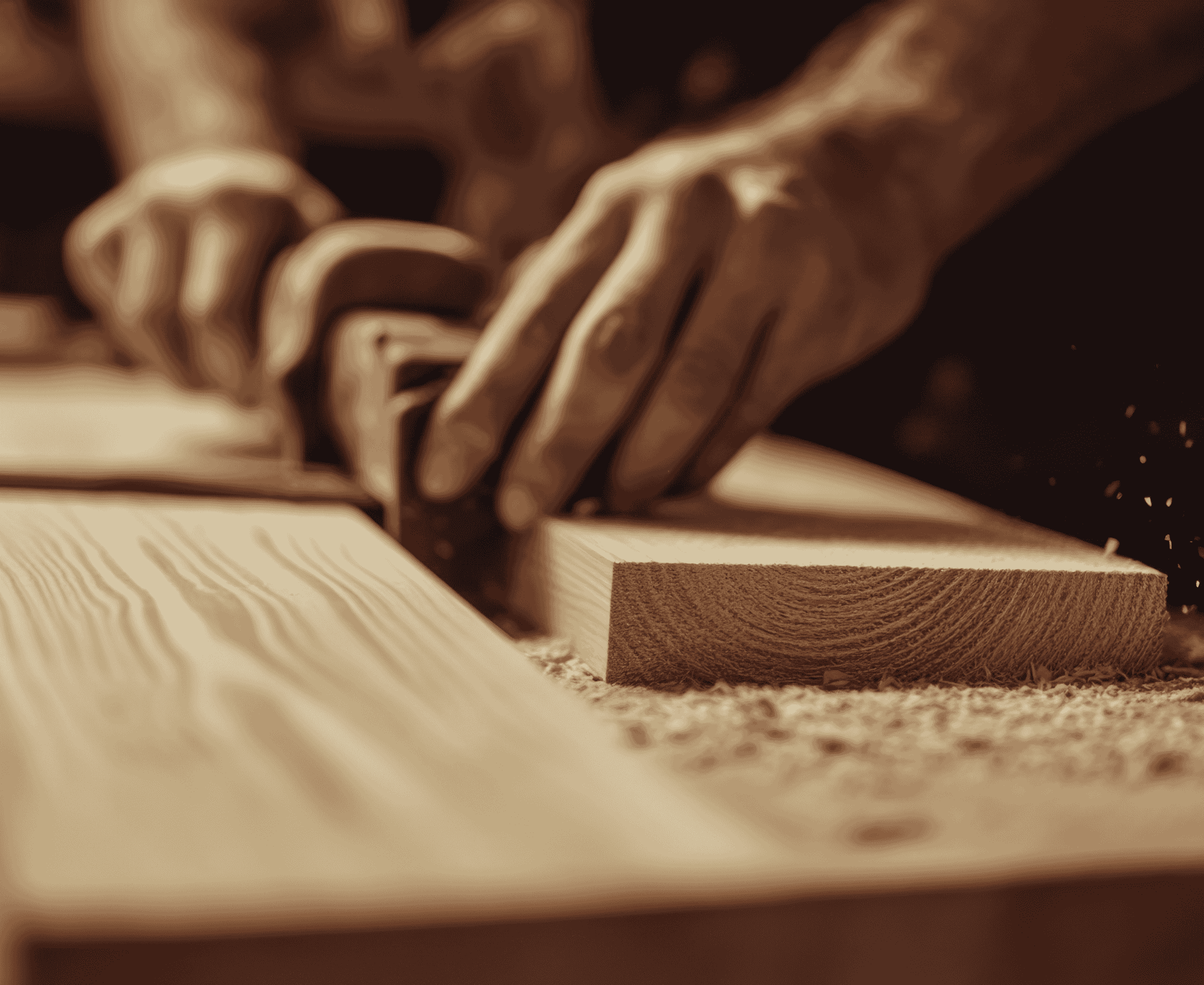 Craftsman planing timber in a joinery workshop – Datum Works carpentry North Wales