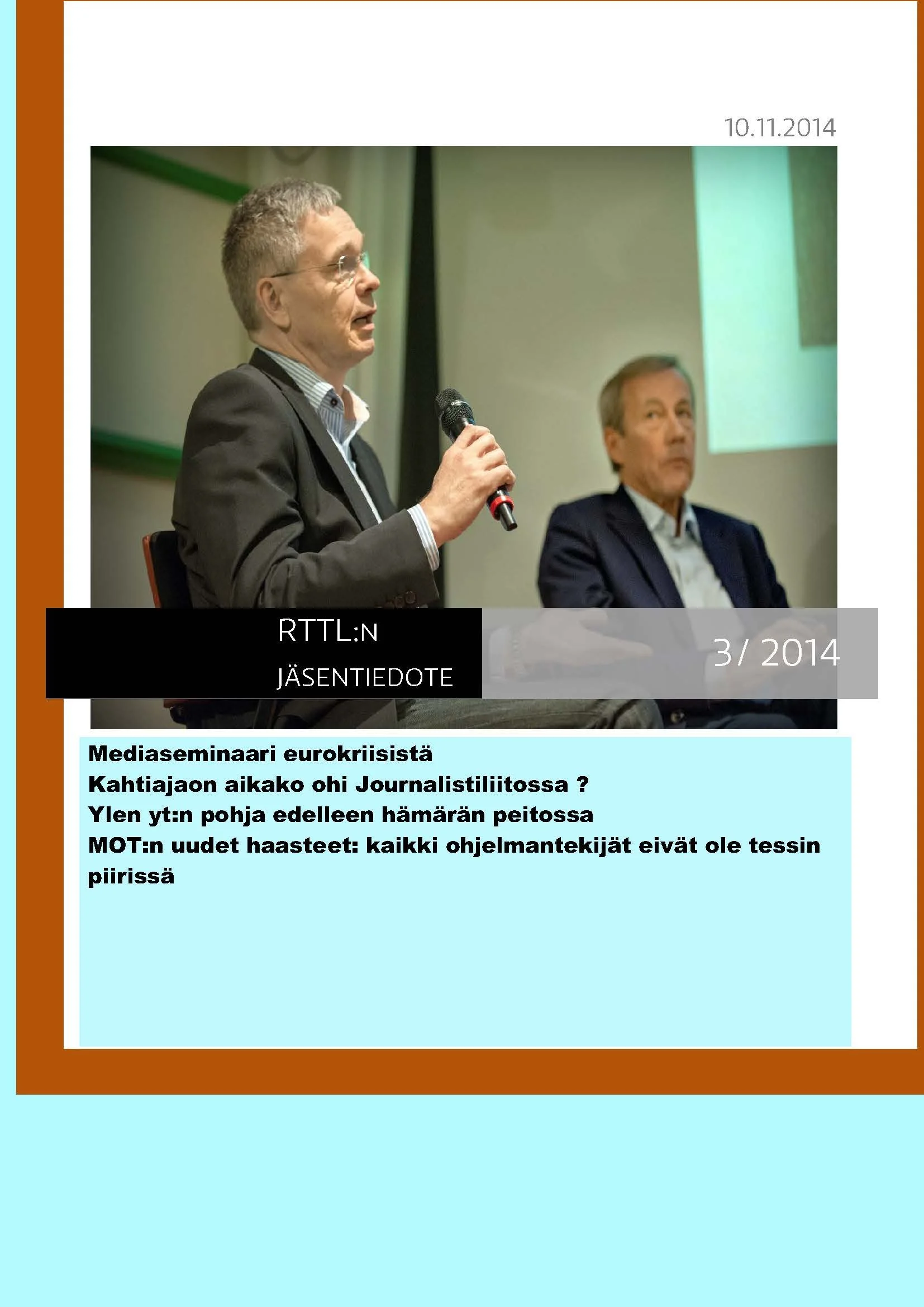 Kuvassa kaksi miestä, toinen puhuu mikrofonilla. "Liiton Arkki" kansilehti.