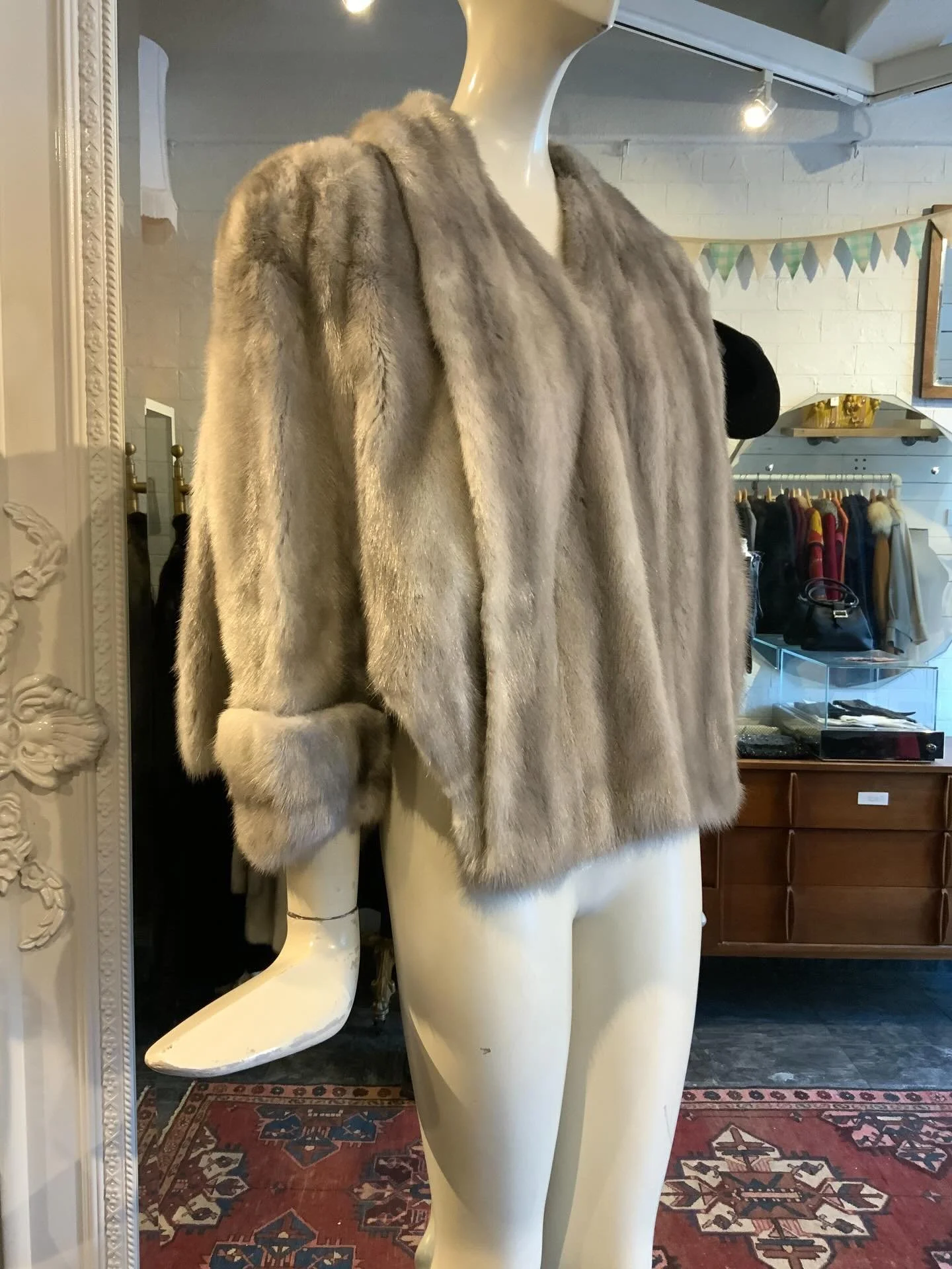 We know how much you are loving fur at the moment,  so we had to make sure you saw this NEW ARRIVAL. Vintage, circa 1950s, silver mink caplet. This piece is like a stole but it has wee pseudo sleeves. We especially love the swing on the back. She is 