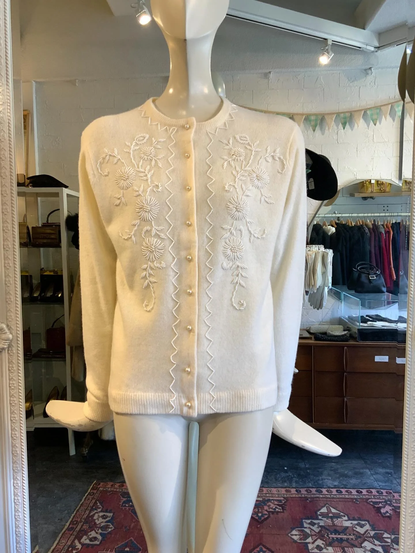 We just got in a handful of 1950s beaded cashmere cardigans that are in lovely condition! This cream and baby pink one can be found on the website ( as well as in store). Stop in to check out the others, or patiently wait until we list them next week