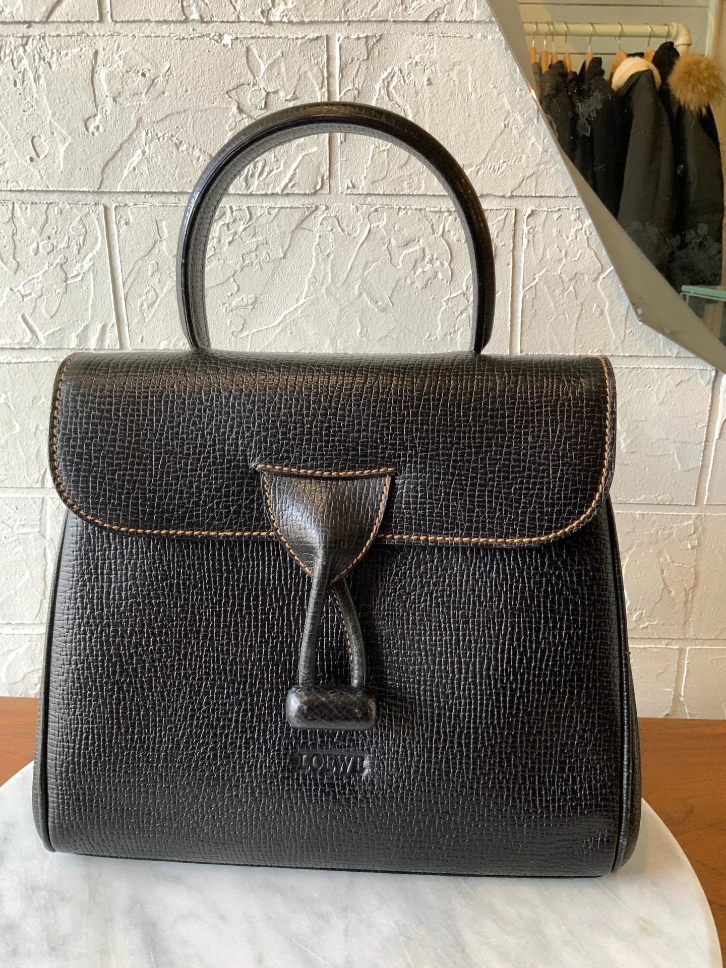 This beauty has just arrived in the shop ( and website) and we are smitten. We love the classic silhouette and the beige top stitching. It has a perfect little top handle but also a crossbody strap, for days when you need to go hands free. 

In lovel