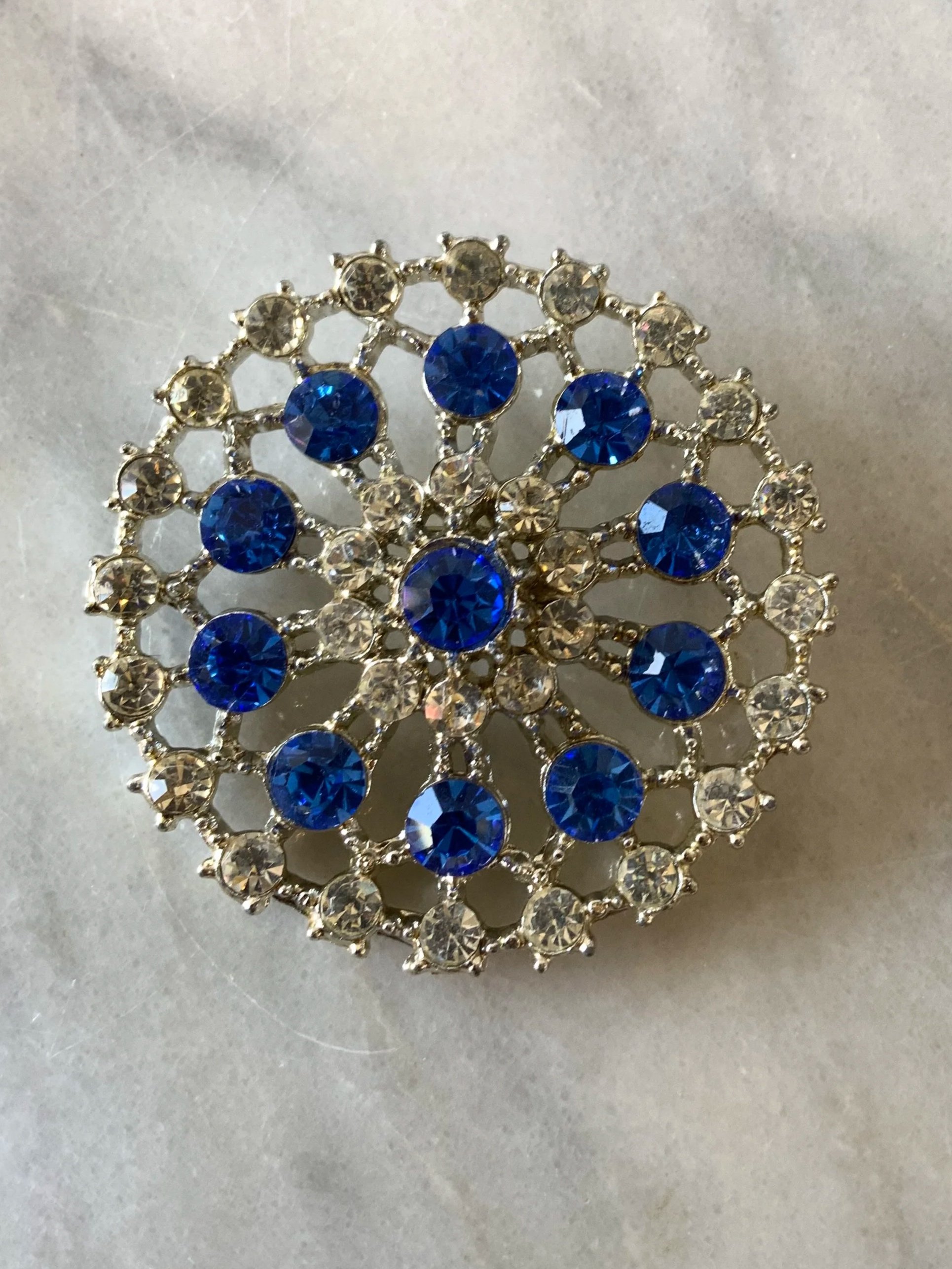 Blue and white rhinestone circular brooch