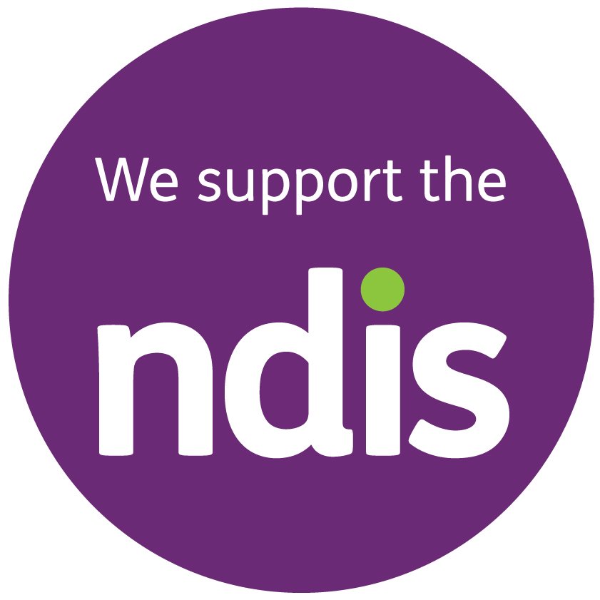 Purple circular logo with white text stating "We support the ndis" with a small green dot above the letter 'i' in 'ndis'.