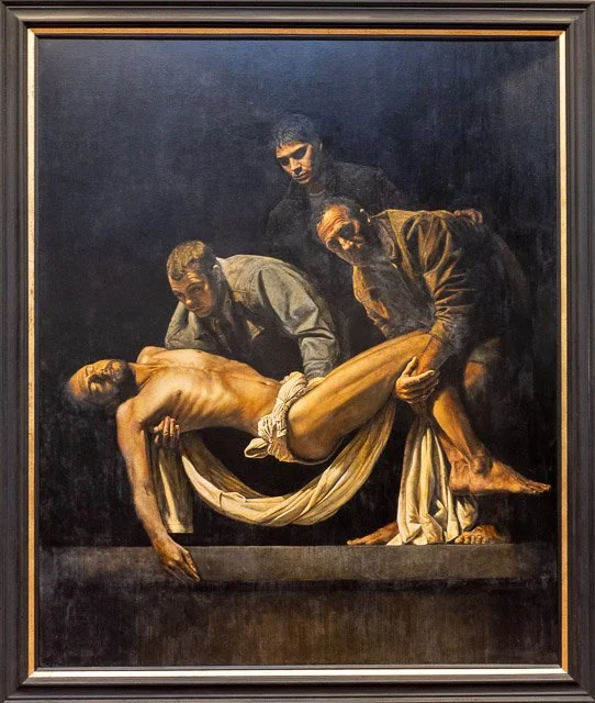 A painting depicting the biblical scene of Jesus Christ being taken down from the cross, with three men handling the body.