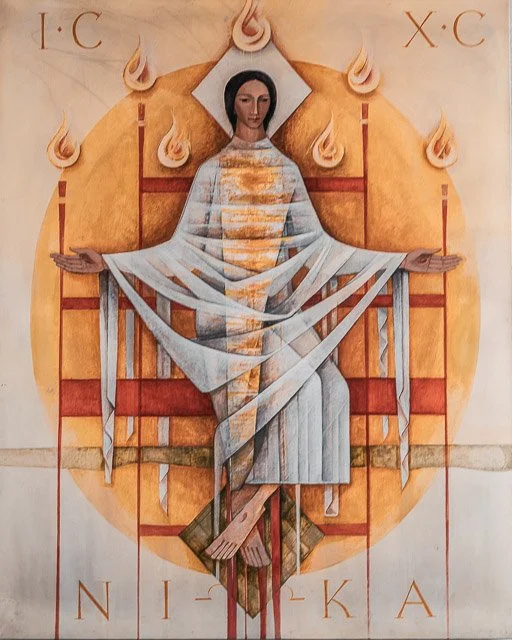 Religious icon of a woman with outstretched arms sitting on a throne, surrounded by flames and halo, with Greek letters above and below.