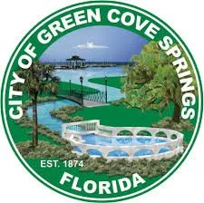 City of Green Cove Springs, Florida emblem featuring a fountain, a body of water, trees, and a bridge.