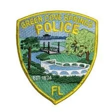 Patch of the Green Cove Springs Police Department in Florida showing a landscape with a bridge, river, trees, and the words 'Green Cove Springs Police FL EST 1874'.