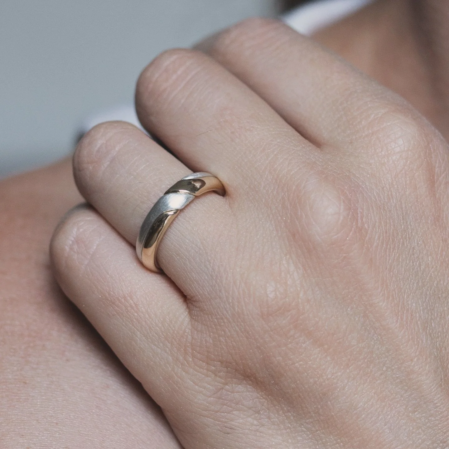 A gimmel ring is a historic symbol of love and unity, featuring two or more interlocking bands that fit together seamlessly. Traditionally exchanged as betrothal or wedding rings, it represents the bond between two people. You can wear it as a friend