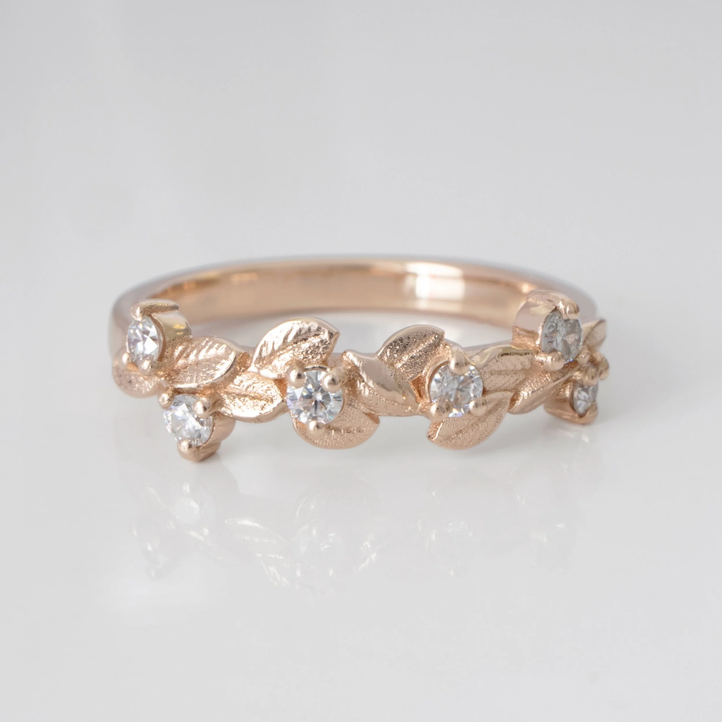 The leaf band with diamonds in 14K Rose Gold is a tiny, shiny vine wrapped around your finger, as timeless as nature itself. 
✧
#emmakrafft #newnostalgia #customjewelry #customengagementring  #vintageweddingband