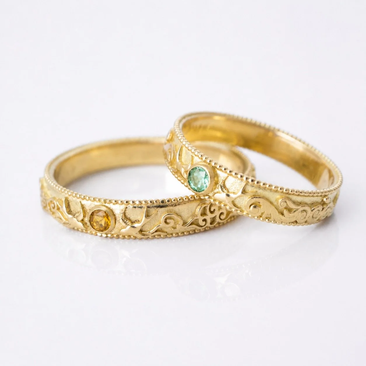 Sparrows, soft clouds and swirling skies with Citrine representing the warmth of the sun and Seafoam tourmaline representing the sea. A custom couple&rsquo;s ring for a summer wedding. 
✧
#emmakrafft #summerjewelry #oceanrings #summerwedding #customw