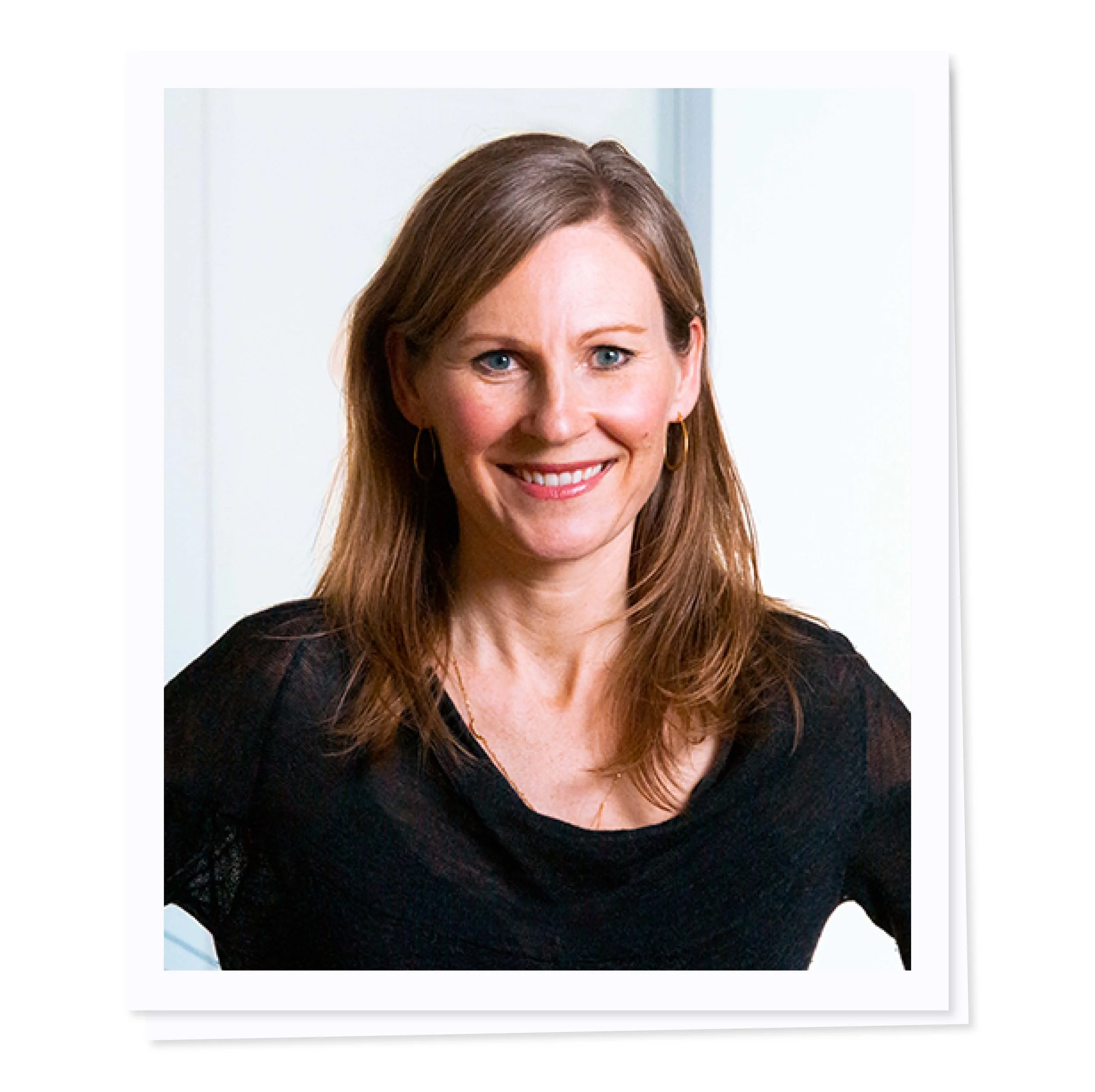 Woman smiling in a black shirt