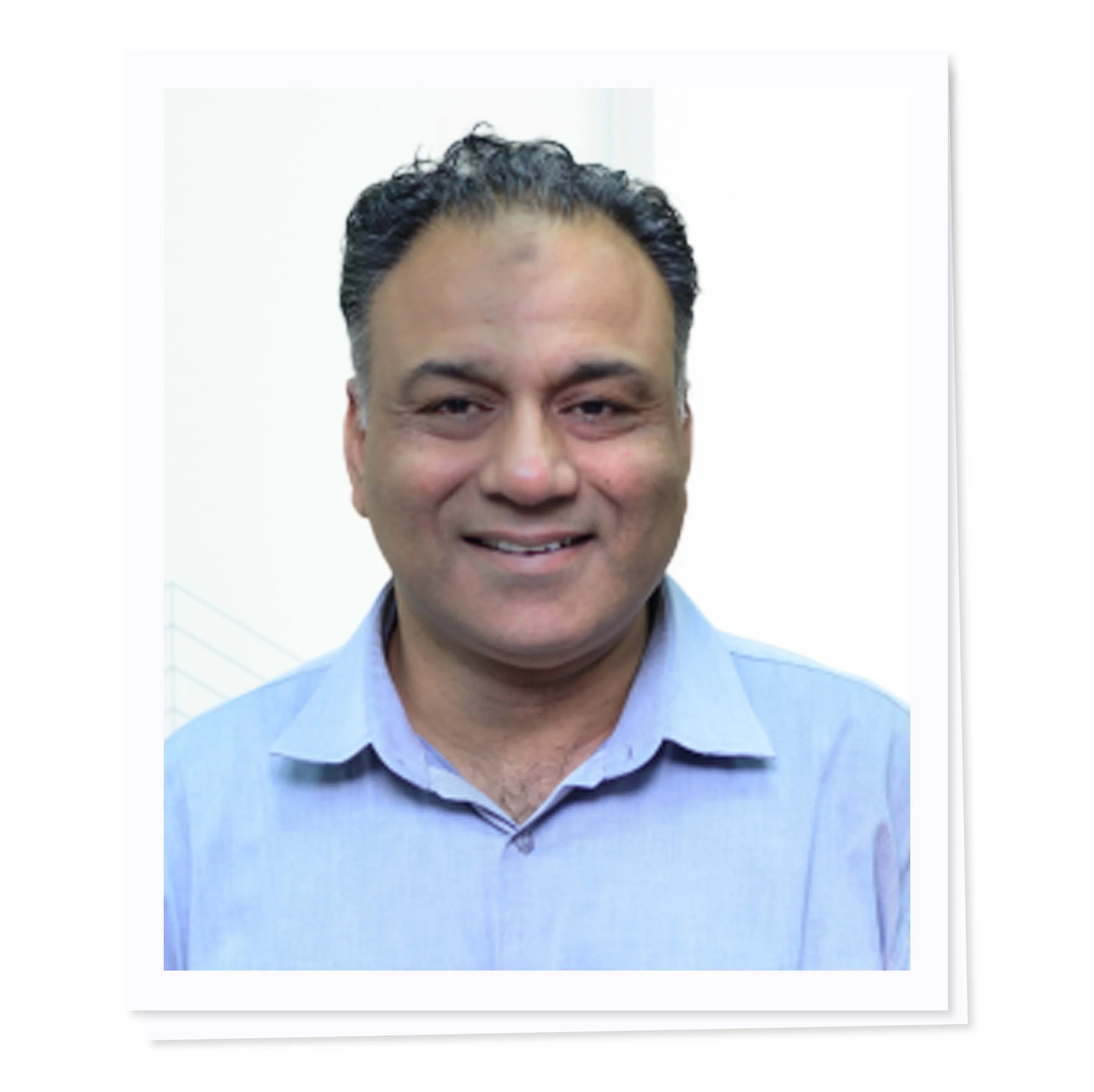 Smiling man in a light blue shirt