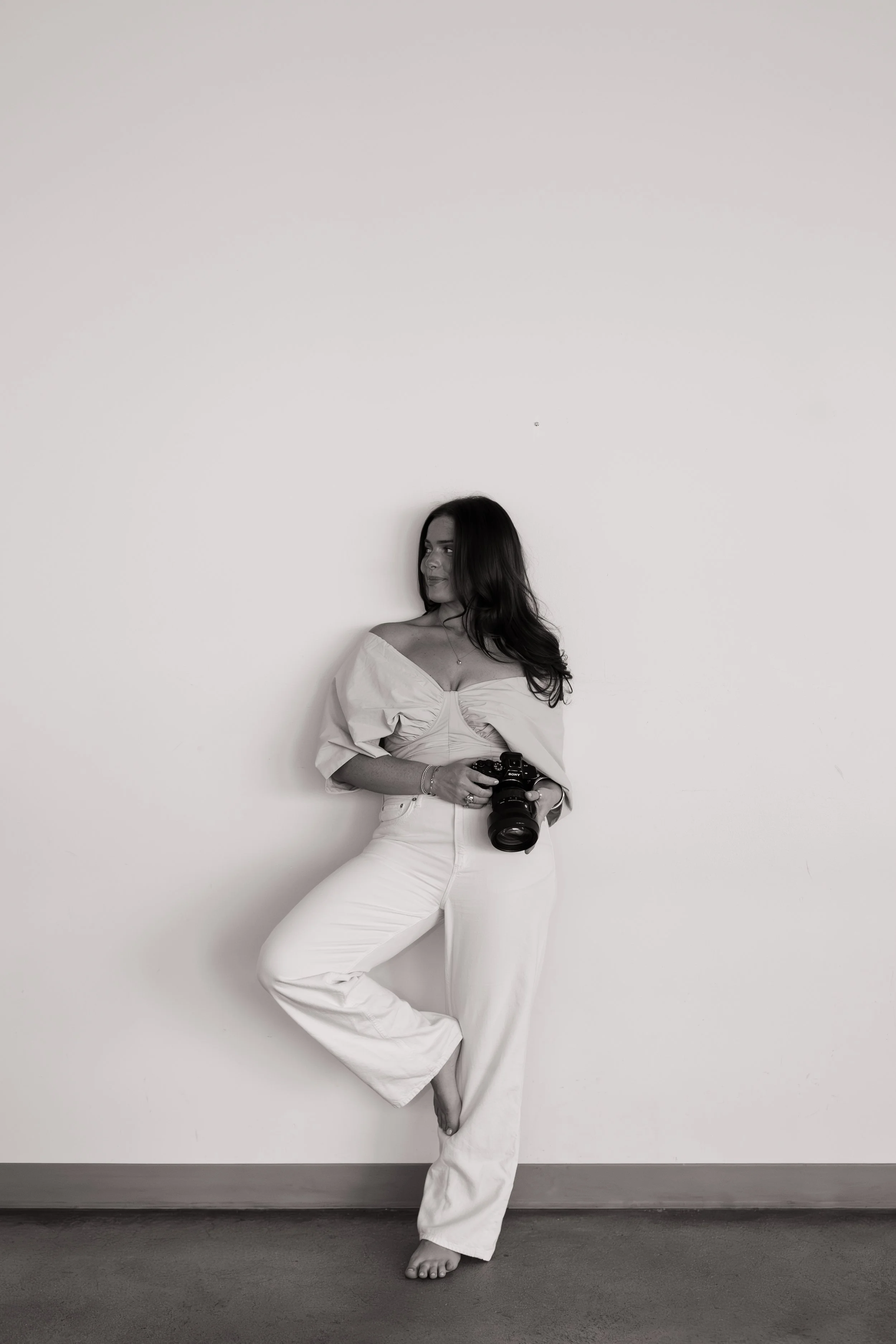 Fargo North Dakota photographer Sydney of Aesthete Pix holding camera portrait