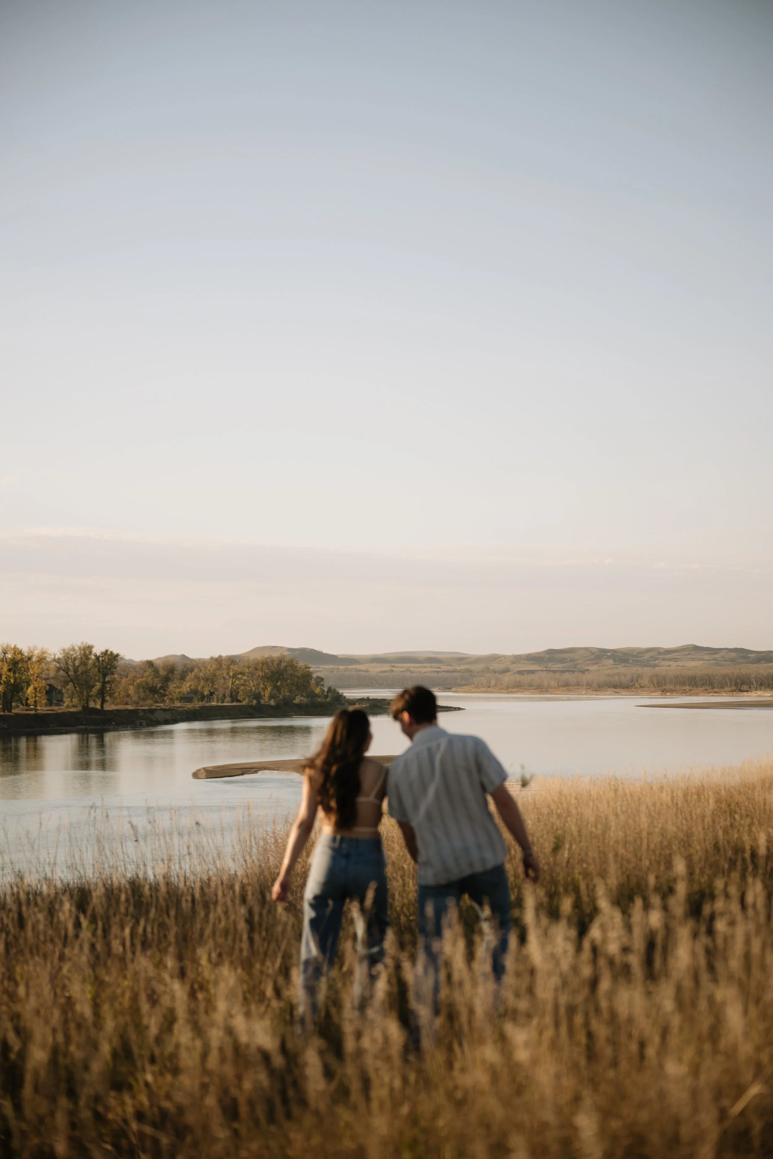 Bismarck North Dakota engagement photos in golden field at sunset by Aesthete Pix
